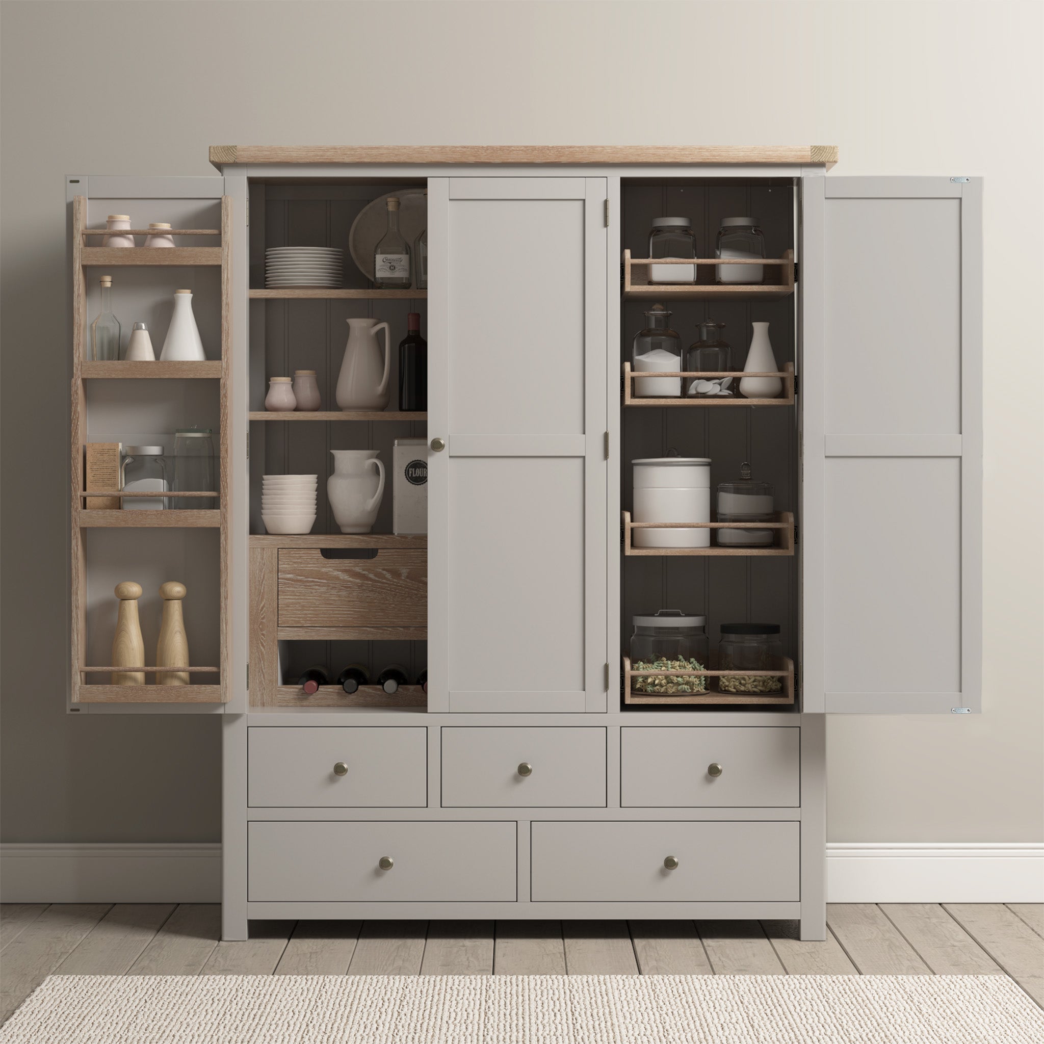 Sage green larder unit with two doors, two drawers, and a wooden top, against a white background.