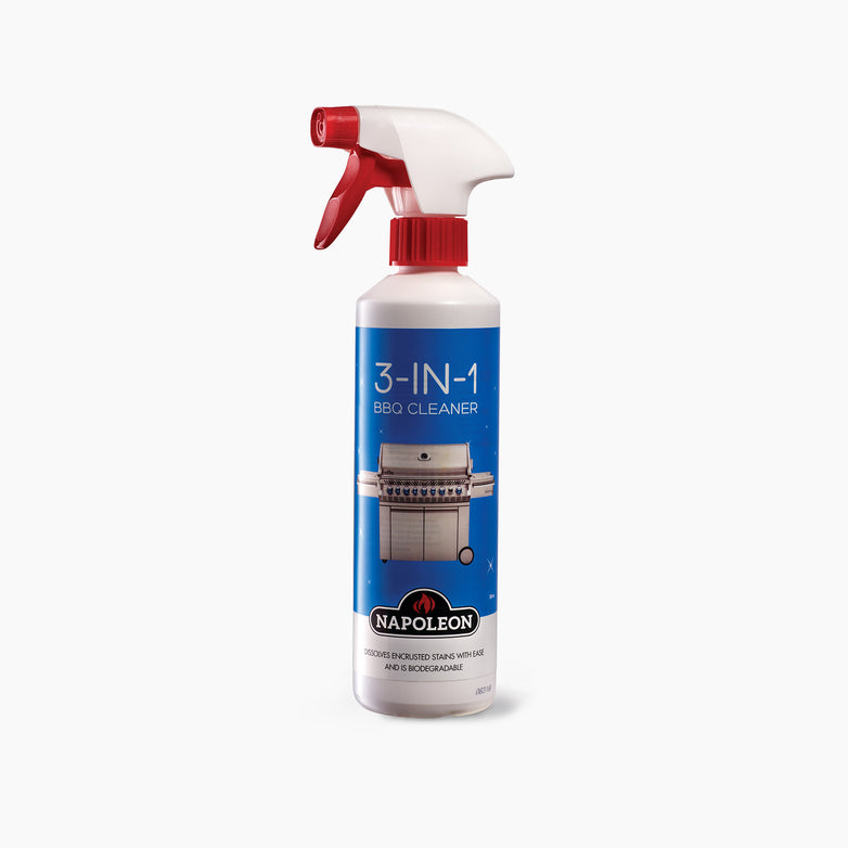 A 500ml bottle of Napoleon 3 In 1 BBQ Cleaner, featuring a red spray nozzle and a blue label illustrating a grill, ideal for stainless steel surfaces.