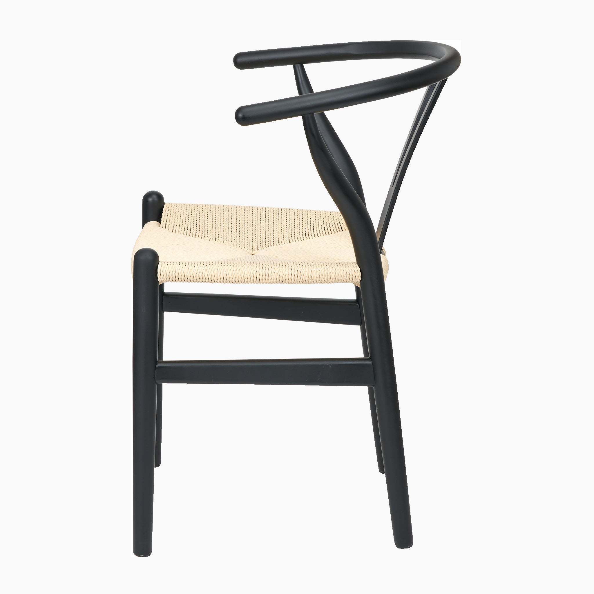 Side view of the Pacific Lifestyle - Quinn Black Beech Wood and Natural Rope Dining Chair, featuring a minimalist design with a curved black beech frame and a beige woven rope seat.