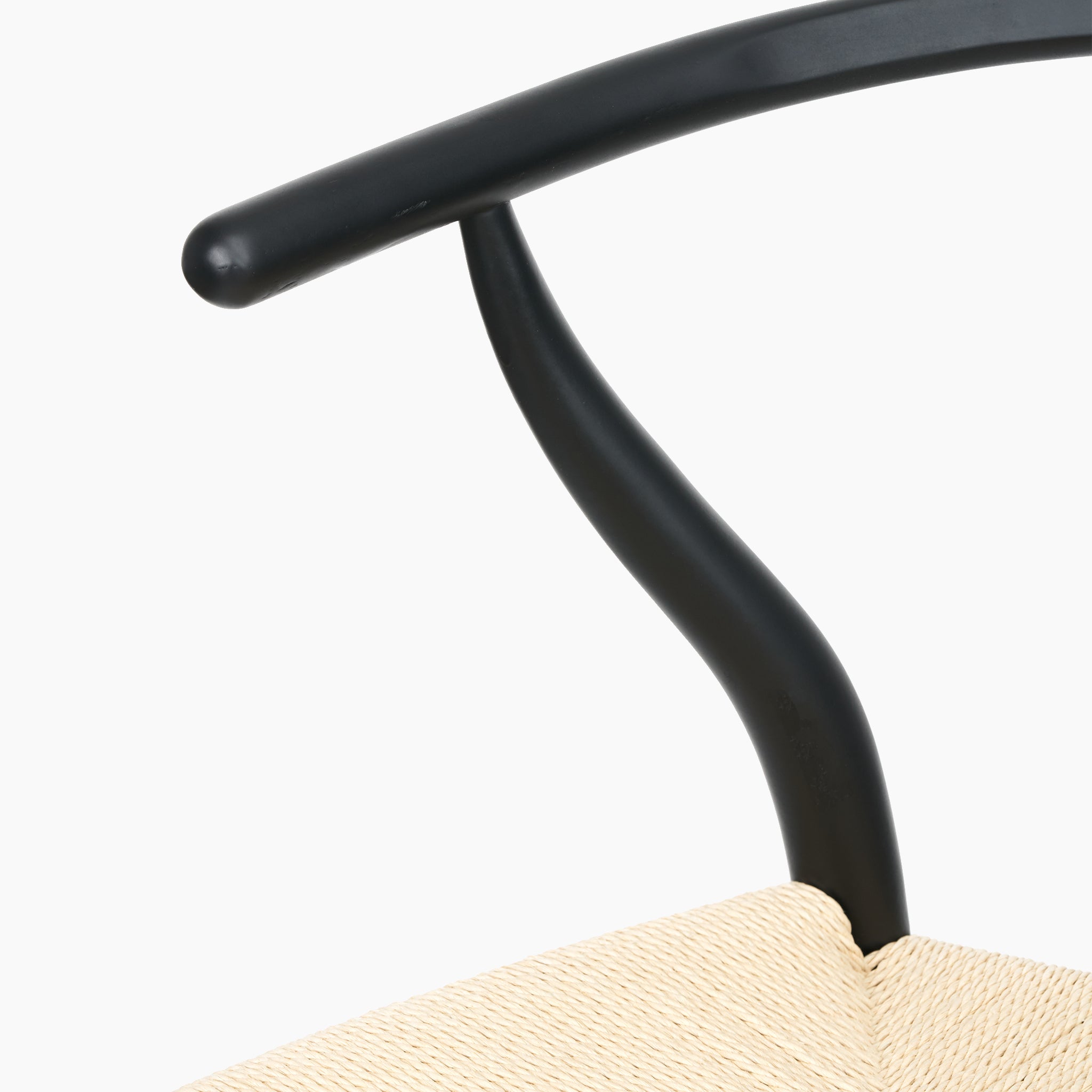 The Pacific Lifestyle - Quinn Dining Chair showcases an elegant curved black beech wood backrest paired with a natural rope seat, blending style and comfort.