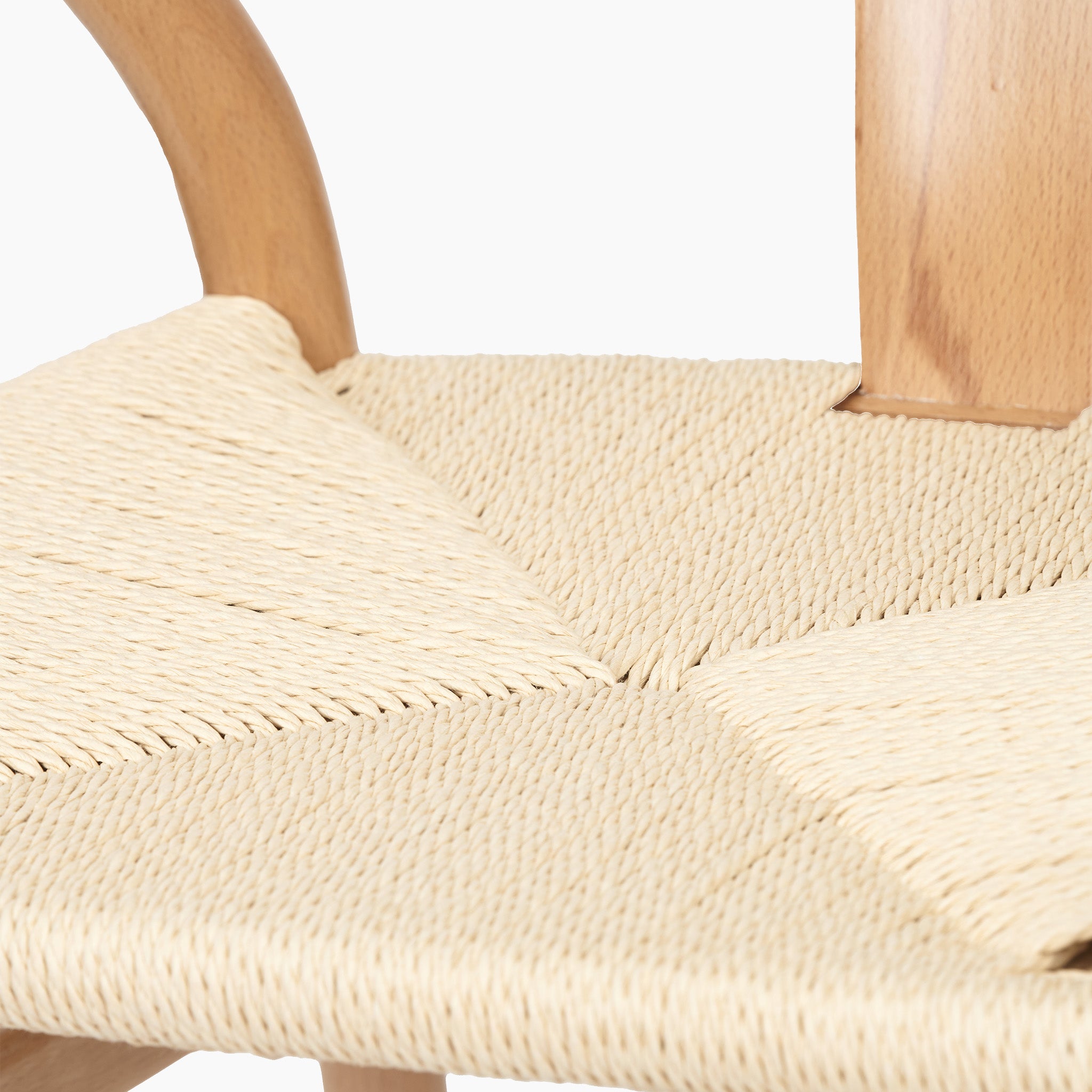 Close-up of the Pacific Lifestyle Quinn Dining Chair, crafted from natural beech wood with a woven natural rope seat.