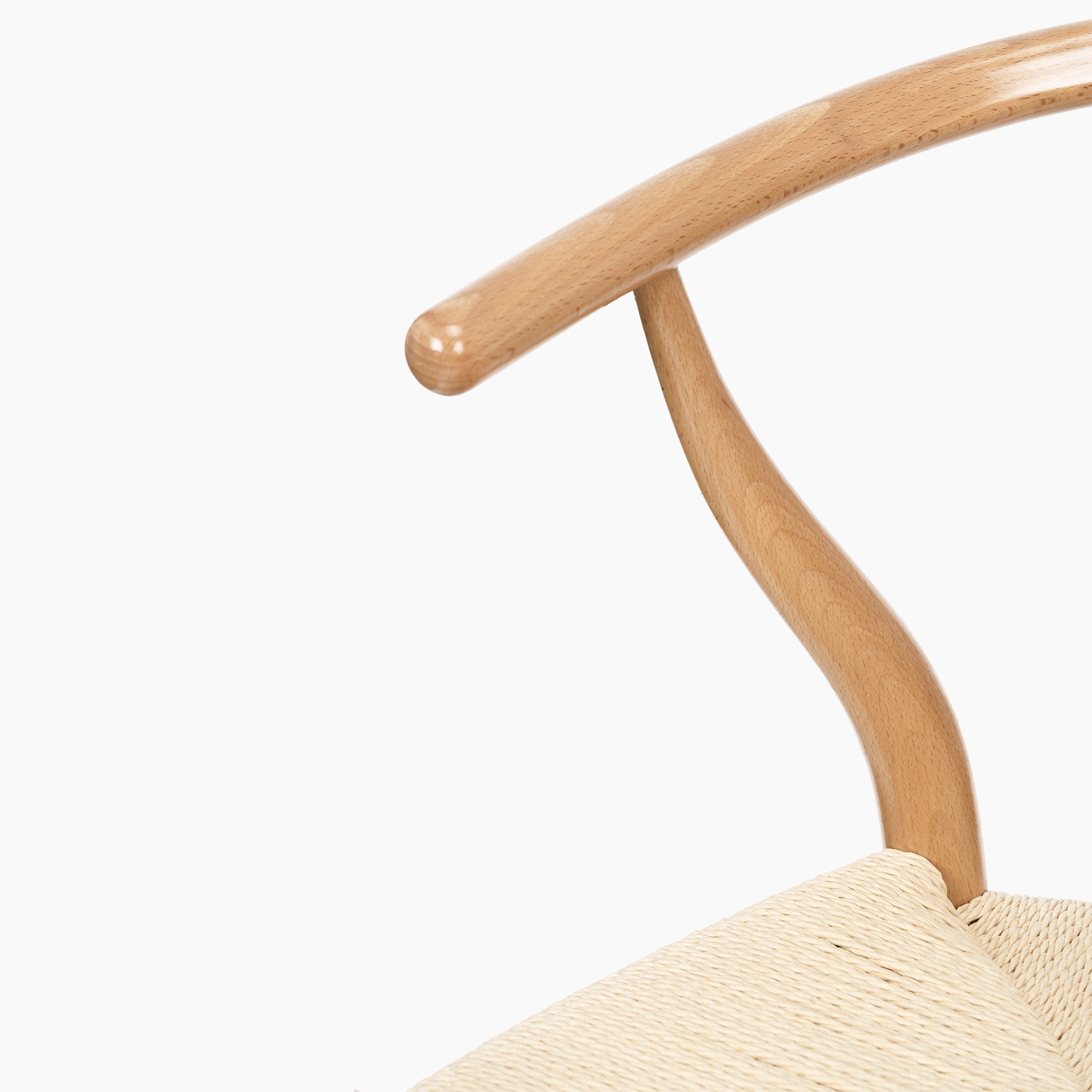Close-up of the Pacific Lifestyle - Quinn Dining Chair's sleek beech wood armrest and intricately woven natural rope seat, showcased against a white background.