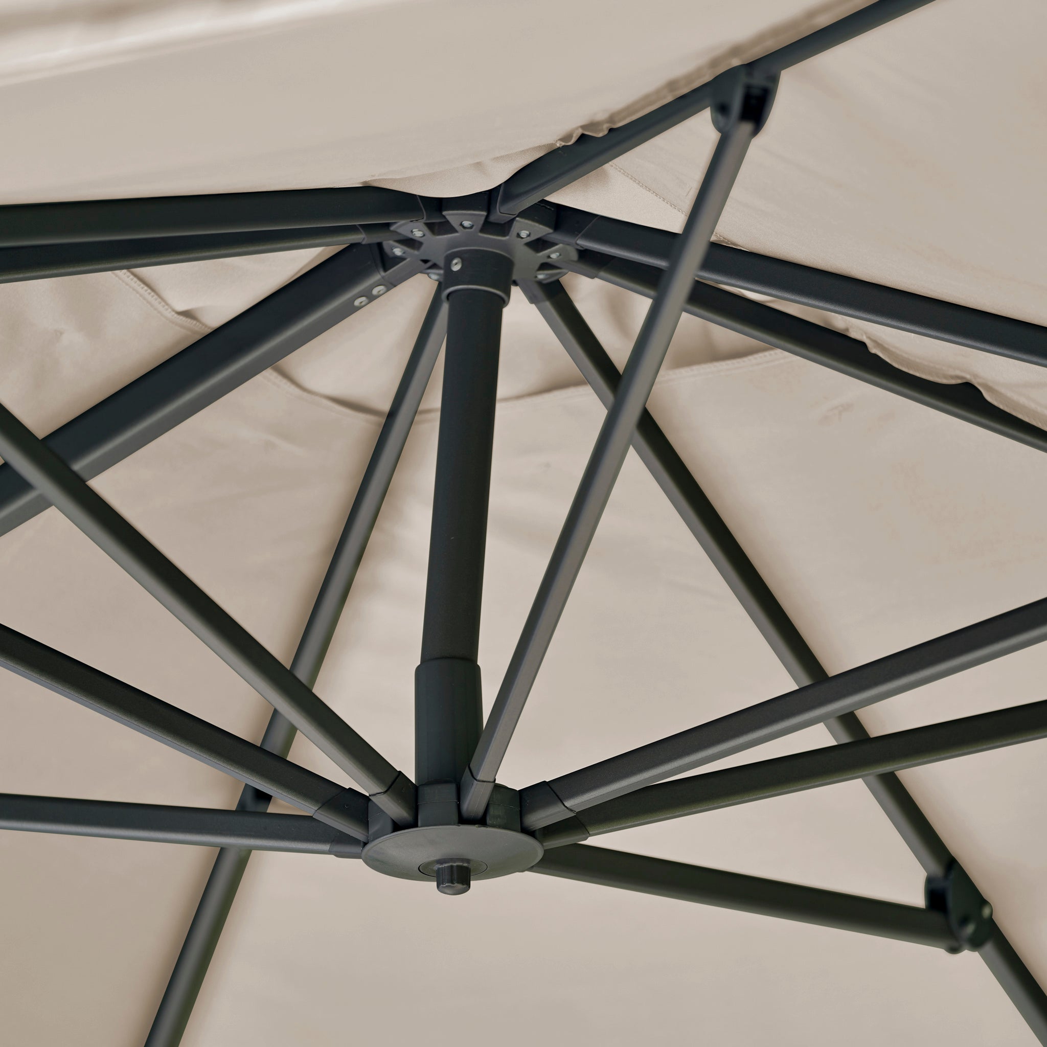 Close-up of the sturdy black metal frame and beige underside of the Challenger T2 Premium 3.5m x 2.6m Rectangular Cantilever Parasol in Champagne, highlighting its robust construction and elegant design.