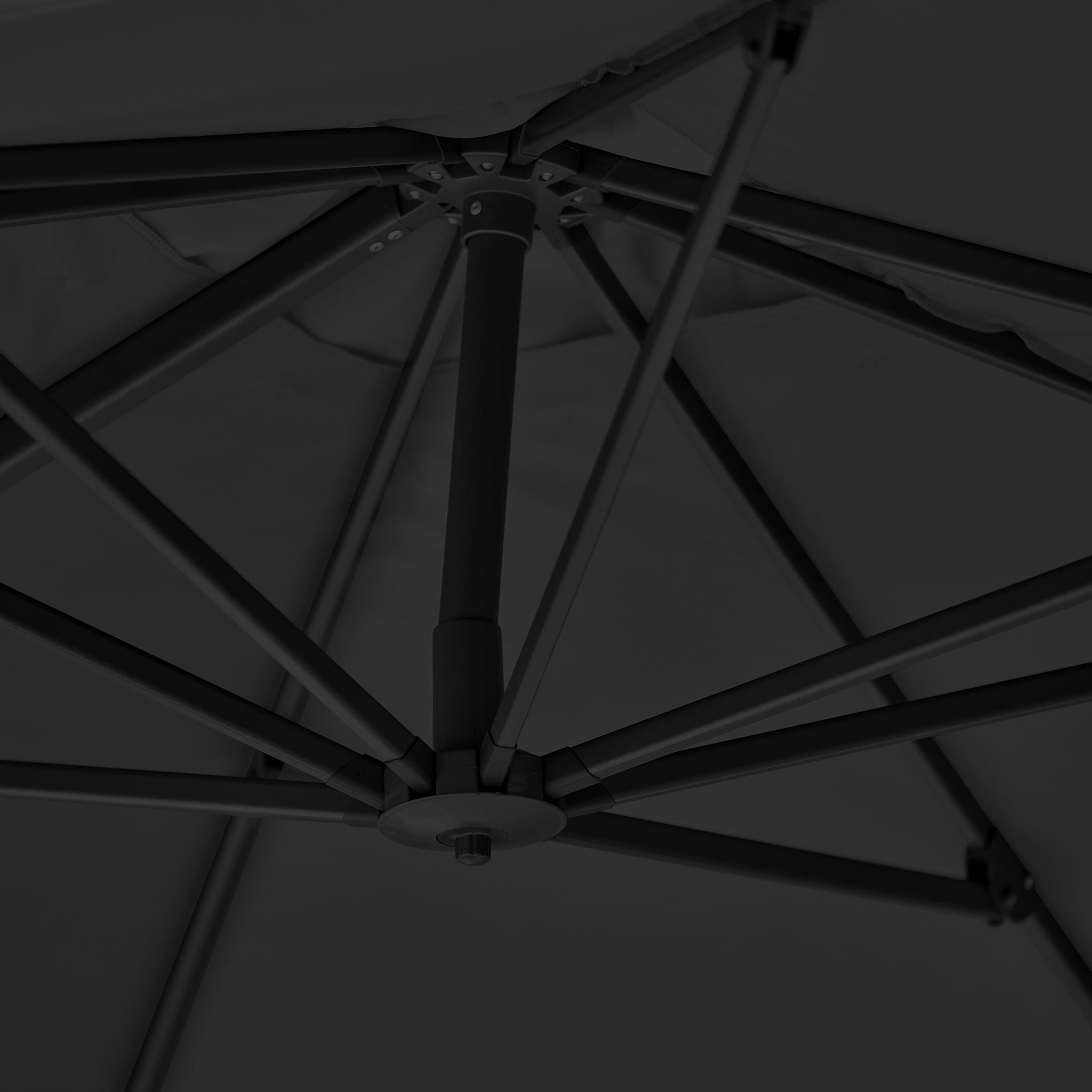 Close-up view of the Challenger T2 Premium 3.5m x 2.6m Rectangular Cantilever Parasol in Black, highlighting its sturdy spokes and central support pole—ideal for enhancing elegant outdoor spaces.