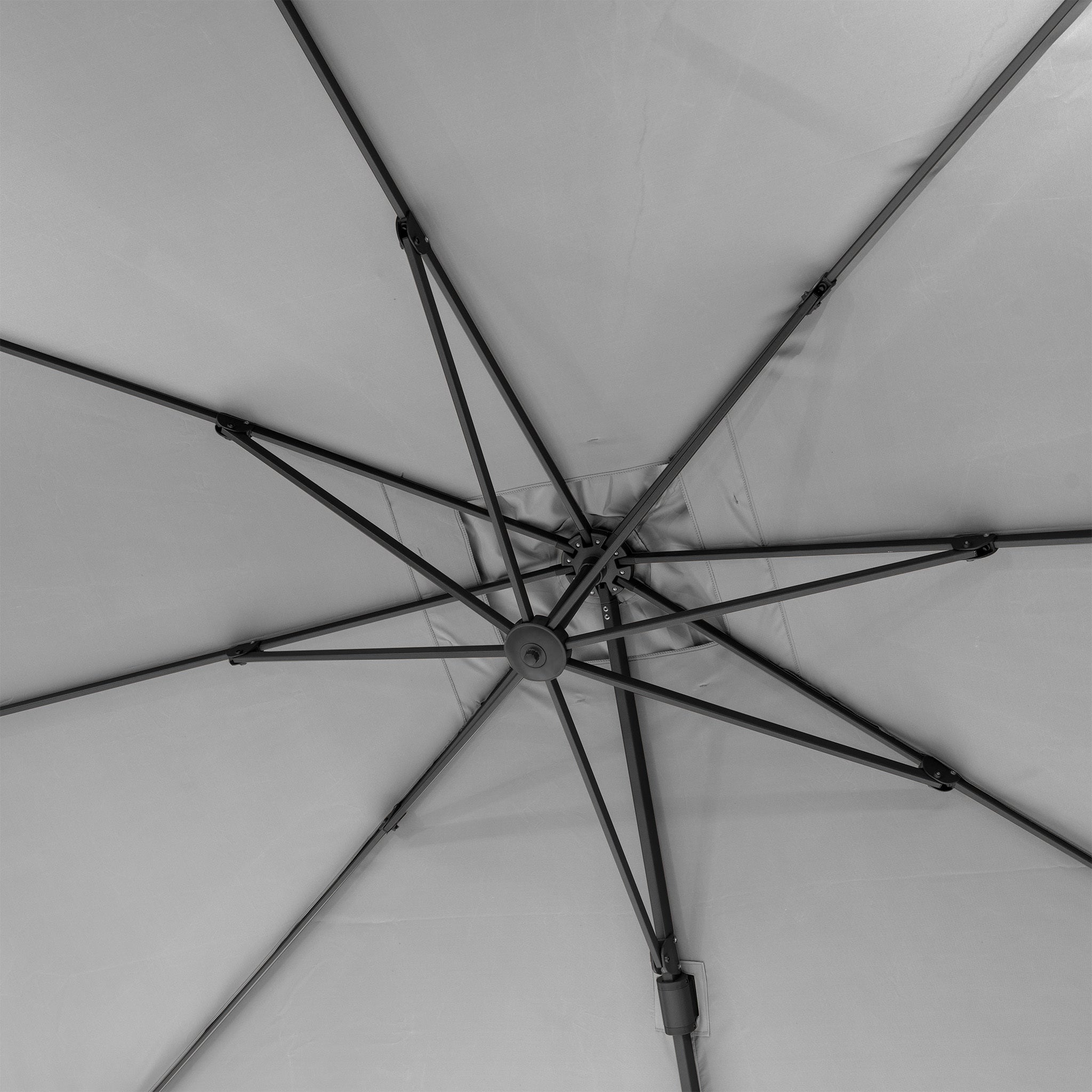 Interior view of the Pacific Lifestyle - Challenger T2 3.5m x 2.6m Rectangular Cantilever Parasol in Grey, showcasing its powder-coated aluminum ribs and central hub in a symmetrical pattern.