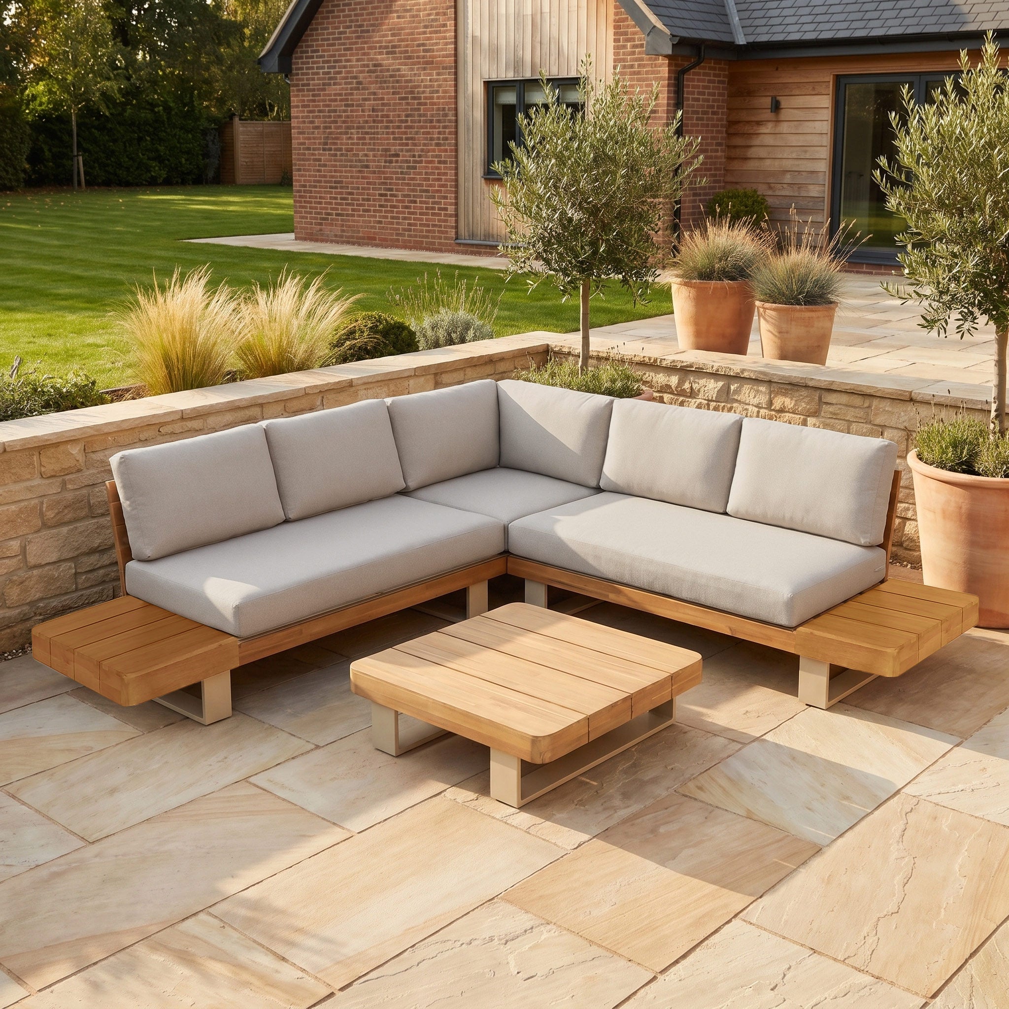 Modern outdoor patio featuring the Ava Corner Sofa Set in Latte, crafted from sustainable acacia wood with light gray cushions and a matching low coffee table—a perfect blend of style and eco-friendly outdoor furniture.