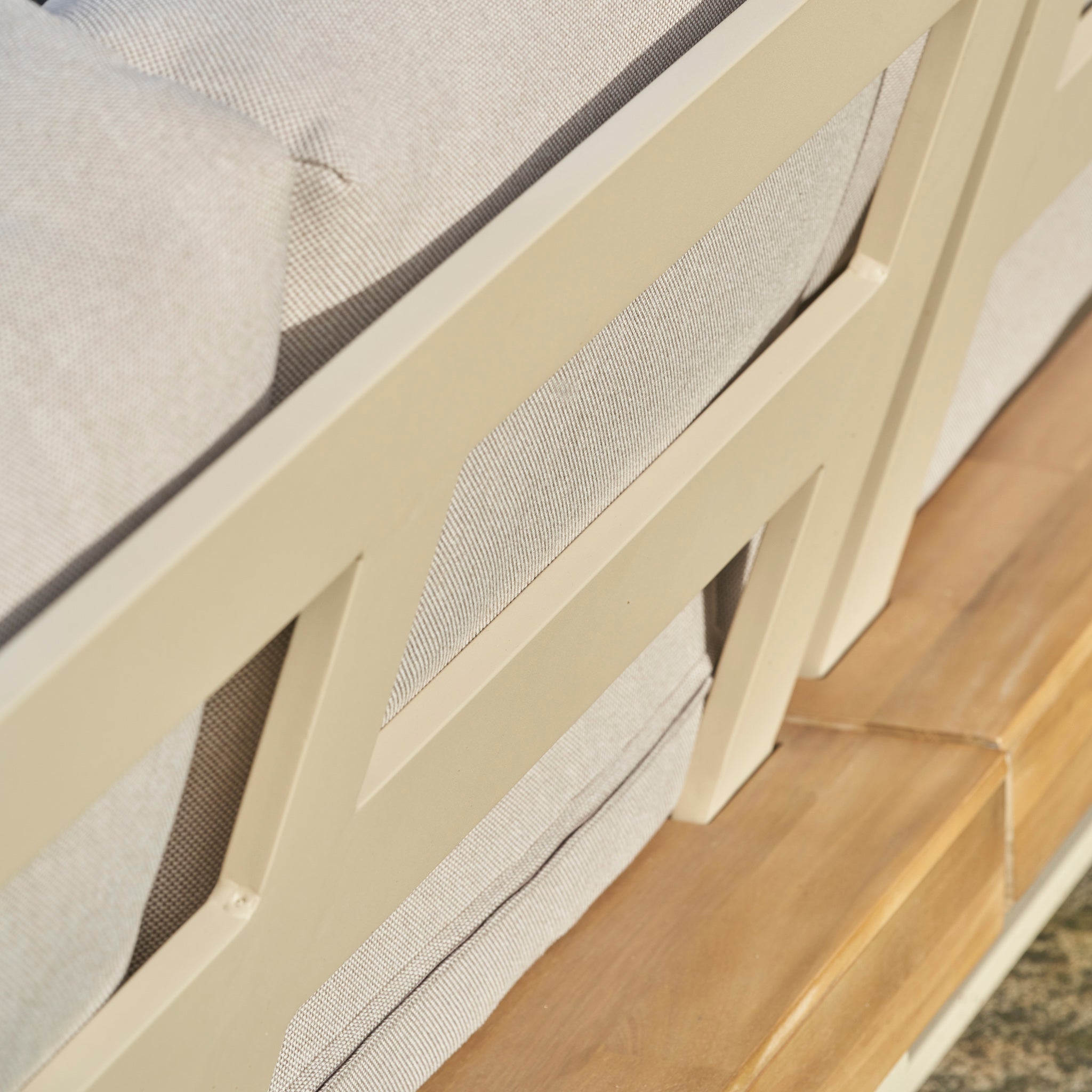 Close-up of the Pacific Lifestyle - Osaka Corner Sofa Set in Latte, featuring light gray cushions and wooden seating crafted from sustainable acacia wood.