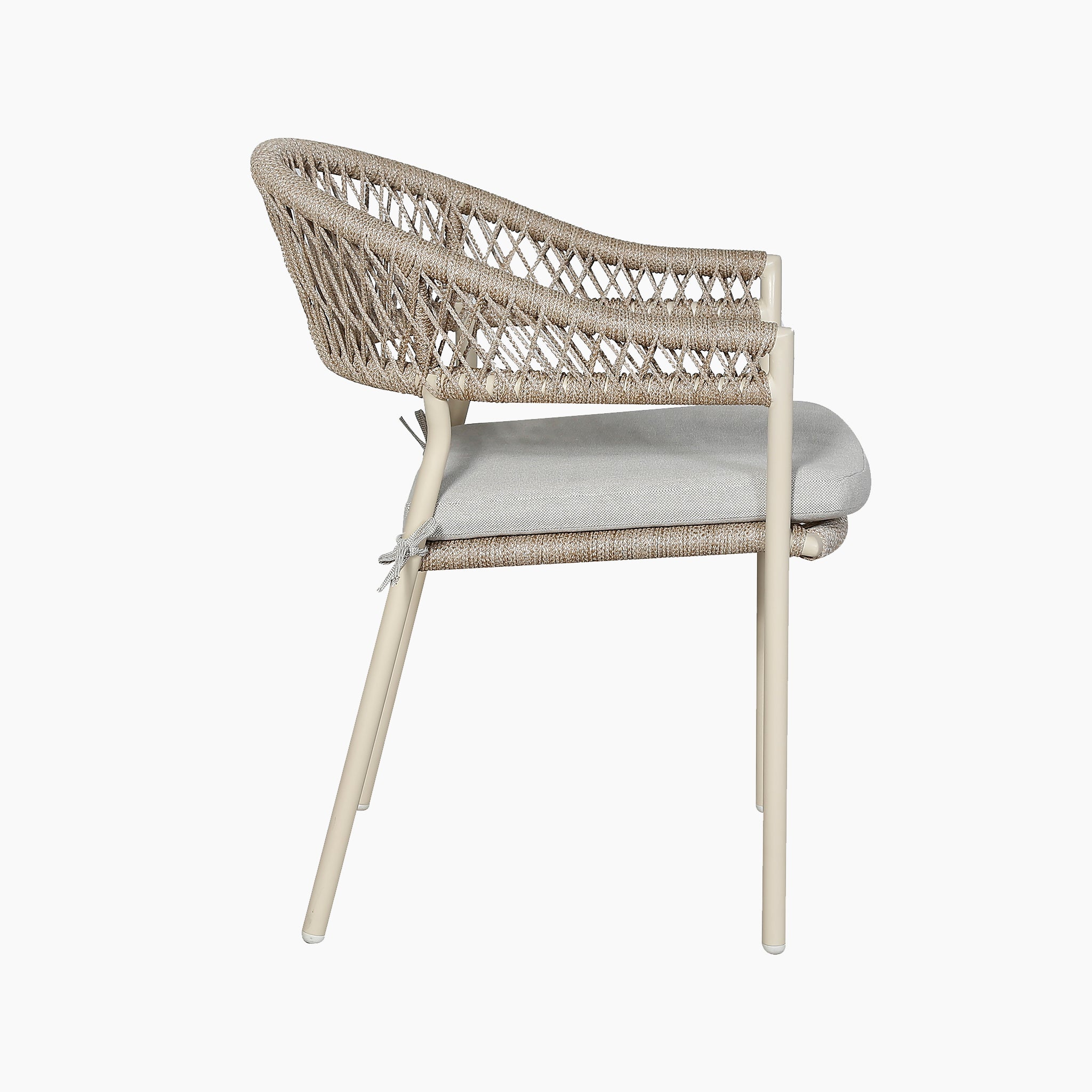 A modern chair with a woven rattan backrest, beige cushion, and light metal legs, viewed from the side—ideal to pair with your Pacific Lifestyle - Osaka 6 Seat Dining Set in Latte for stylish outdoor furniture settings.
