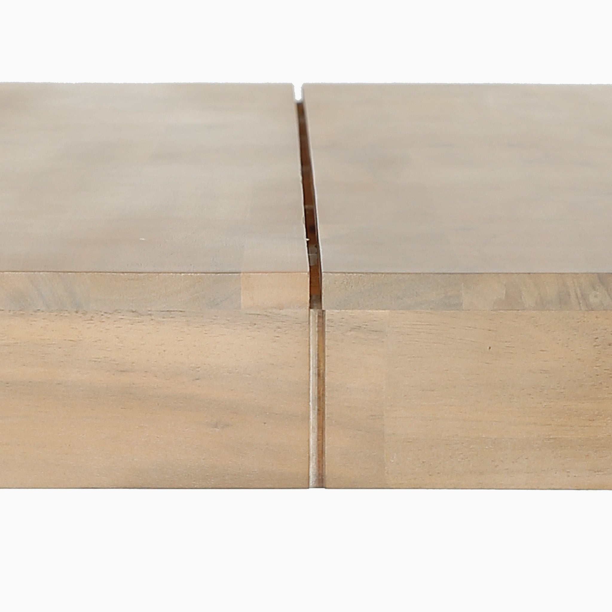 Close-up of two table edges from the Pacific Lifestyle - Osaka 6 Seat Dining Set in Latte, aligned with a narrow gap, showcasing quality craftsmanship—ideal for an outdoor furniture setup on a white background.