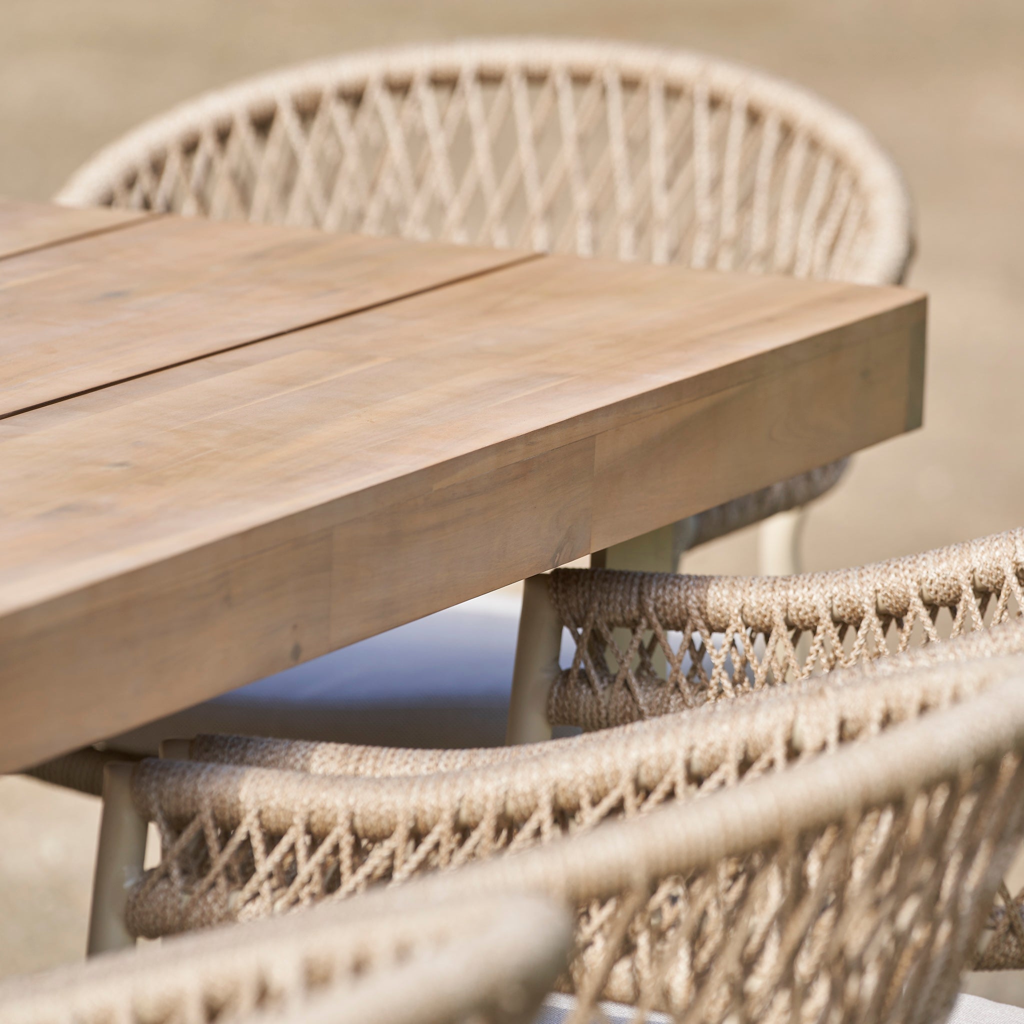 Close-up of the Pacific Lifestyle - Osaka 6 Seat Dining Set in Latte, featuring an acacia wood table and woven rope chairs, perfect for elevating your outdoor furniture collection.
