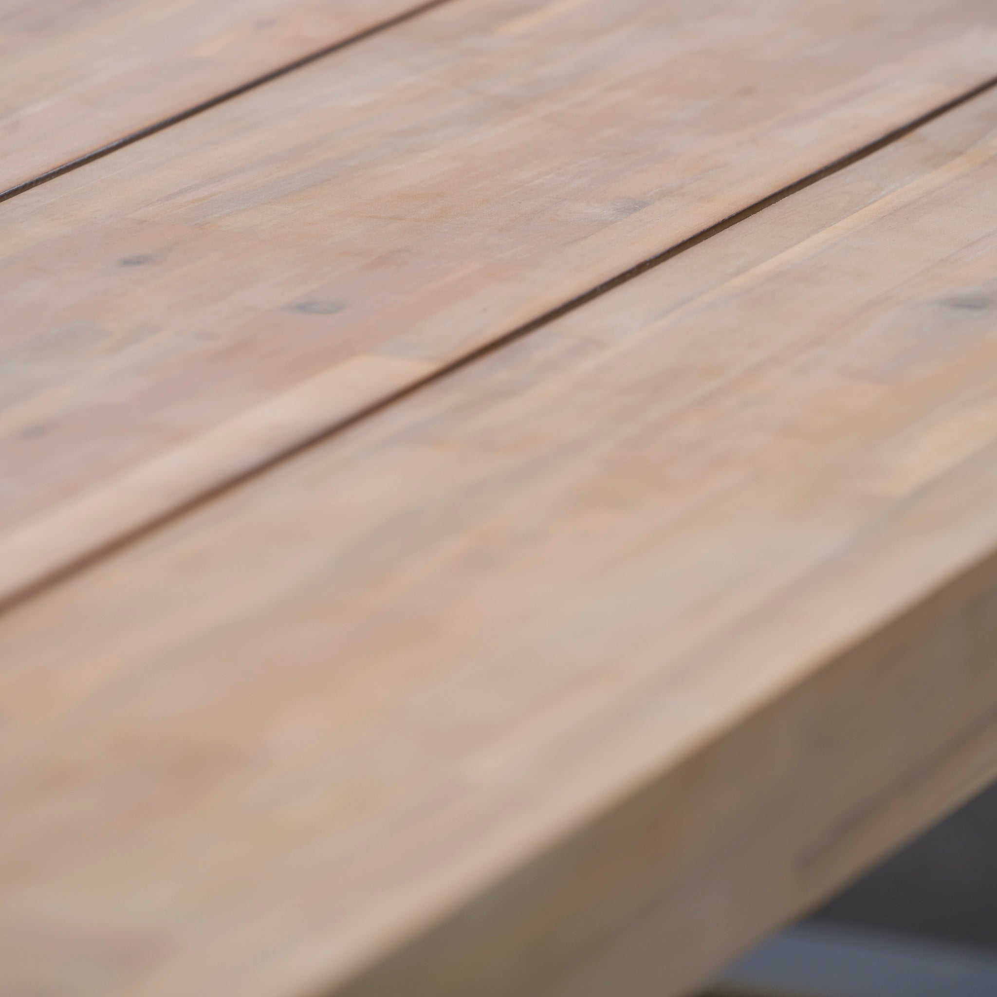 Close-up of the smooth, light-colored surface and visible grain of the Pacific Lifestyle - Osaka 6 Seat Dining Set in Latte, perfect as stylish outdoor furniture for your dining space.