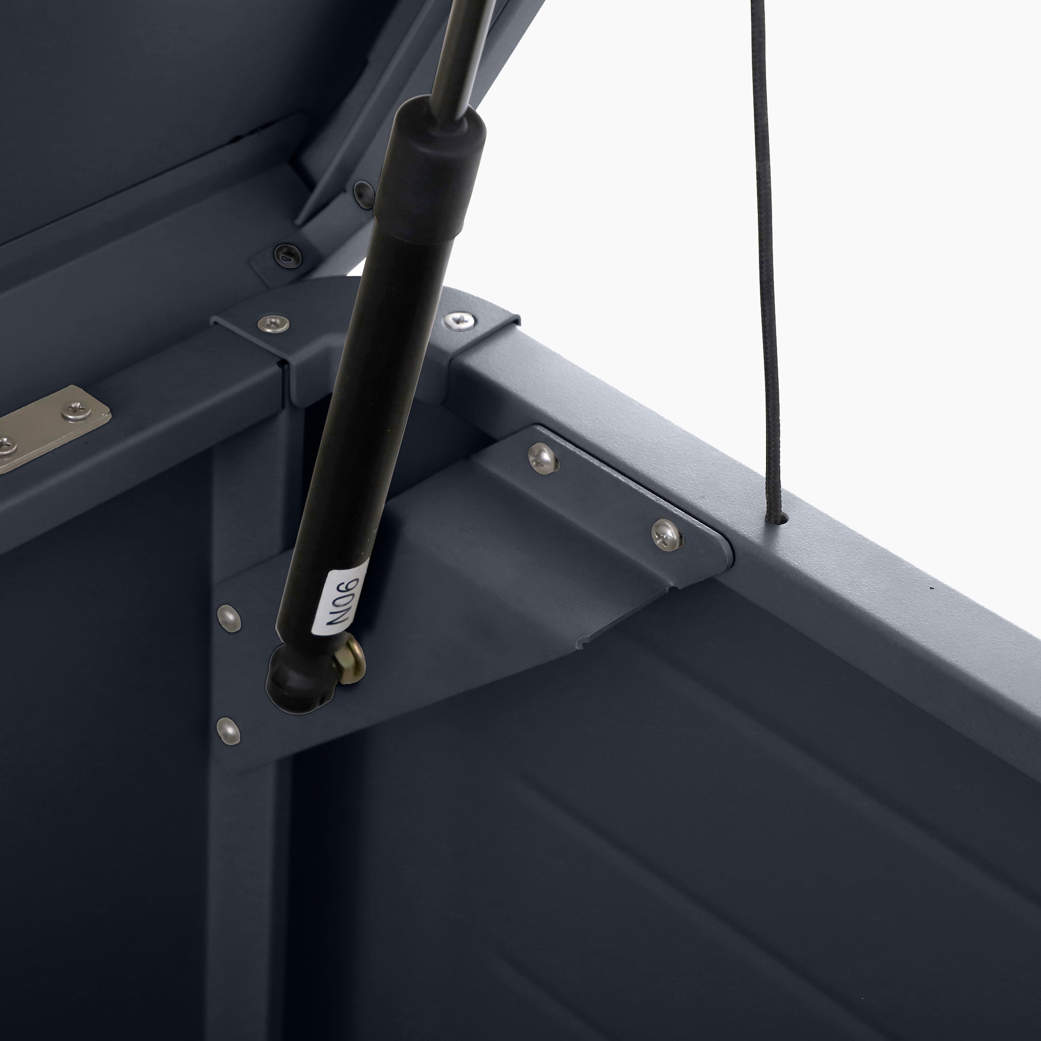 Close-up of a gas strut mechanism inside the Pacific Lifestyle - Rhode Island Large Outdoor Cushion Box in Anthracite, showing durable galvanised steel components.