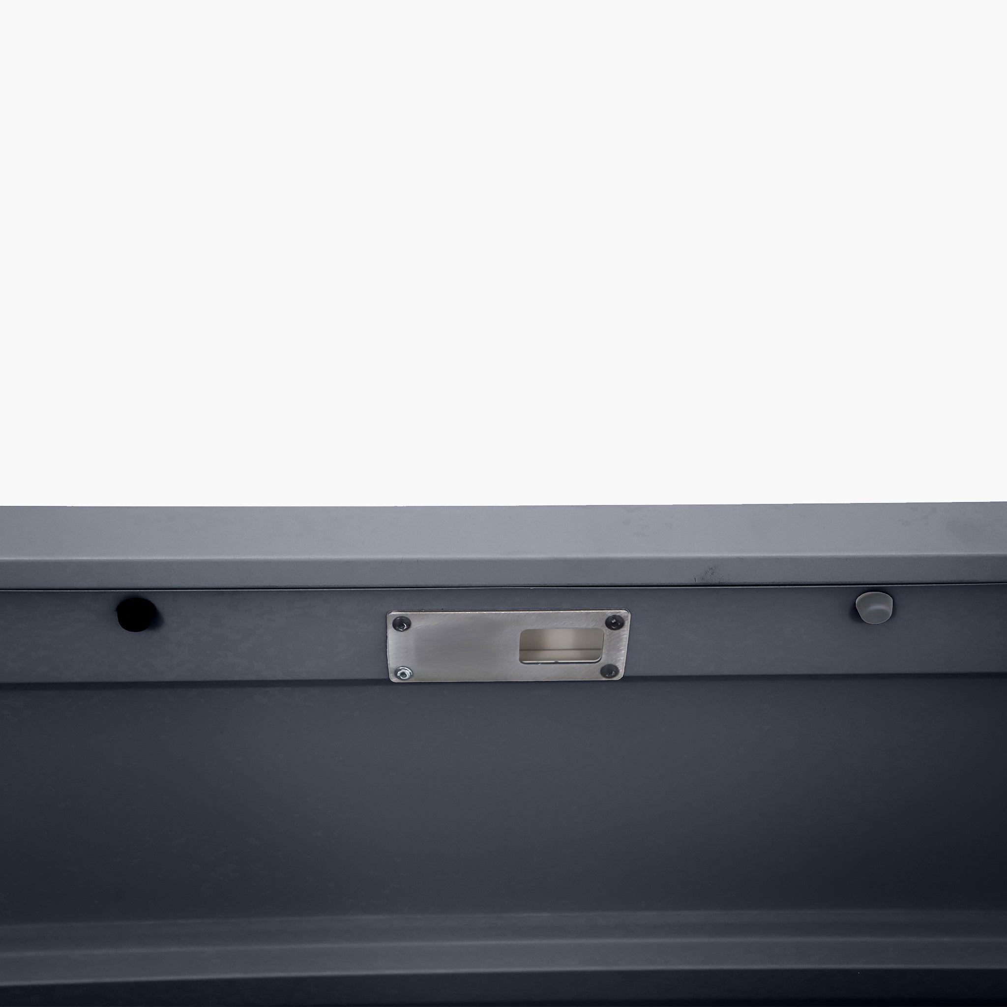 Close-up of the Pacific Lifestyle Rhode Island Large Outdoor Cushion Box in Anthracite, featuring a galvanised steel latch plate and two round holes for secure reinforcement. Ideal for protecting your outdoor cushions.
