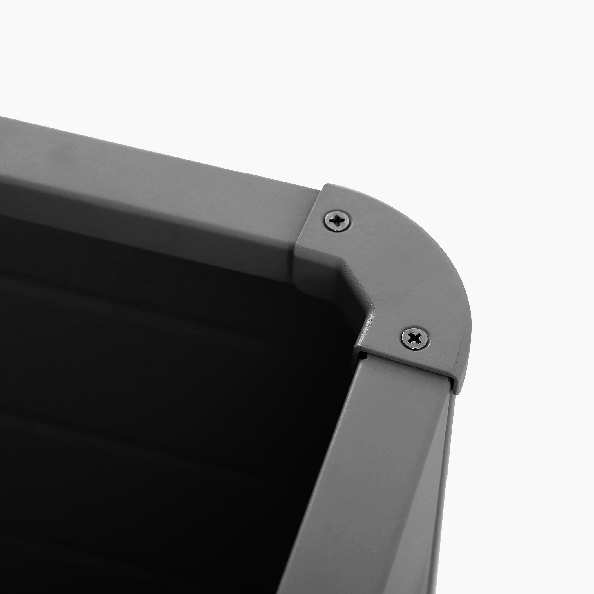 Close-up of an anthracite plastic corner with two screws securing the joint, part of the Pacific Lifestyle Rhode Island Small Outdoor Cushion Box, against a white background.