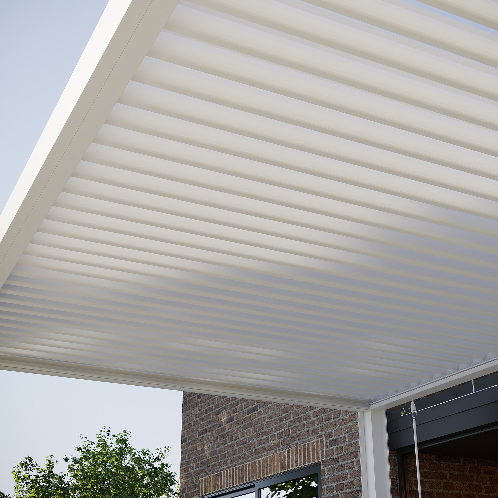 The PergoSTET Plus 4m x 4m Square Pergola with LED Lighting (Frame Only, White) attaches to brick walls—ideal for a contemporary outdoor space with blue sky and leafy views.