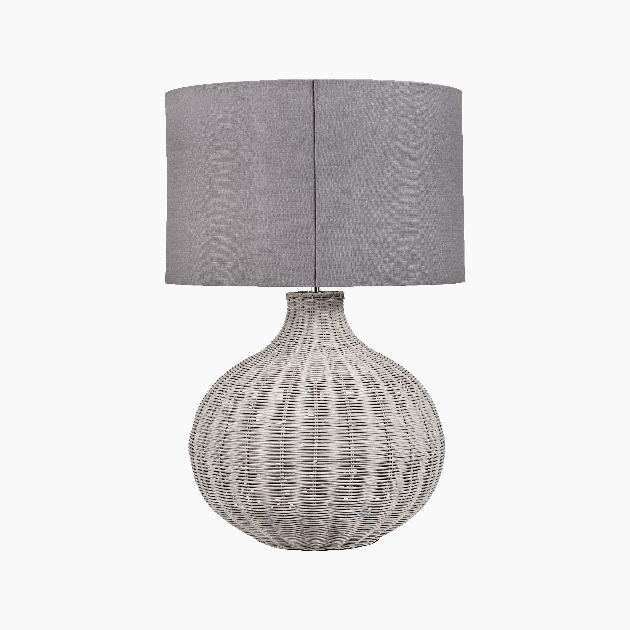 The Pacific Lifestyle Allona Grey Wash Rattan Table Lamp features a woven wicker base with a tall grey linen lampshade, offering an organic tactile finish.