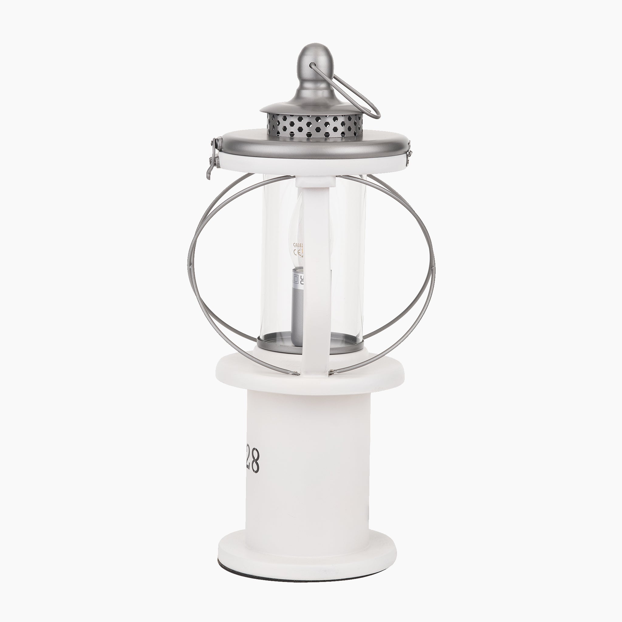 The Pacific Lifestyle Gibson Wood Lantern Table Lamp in White Wood features a silver and white Victorian design with a top handle and clear glass center, ideal for adding elegant decor to any setting.