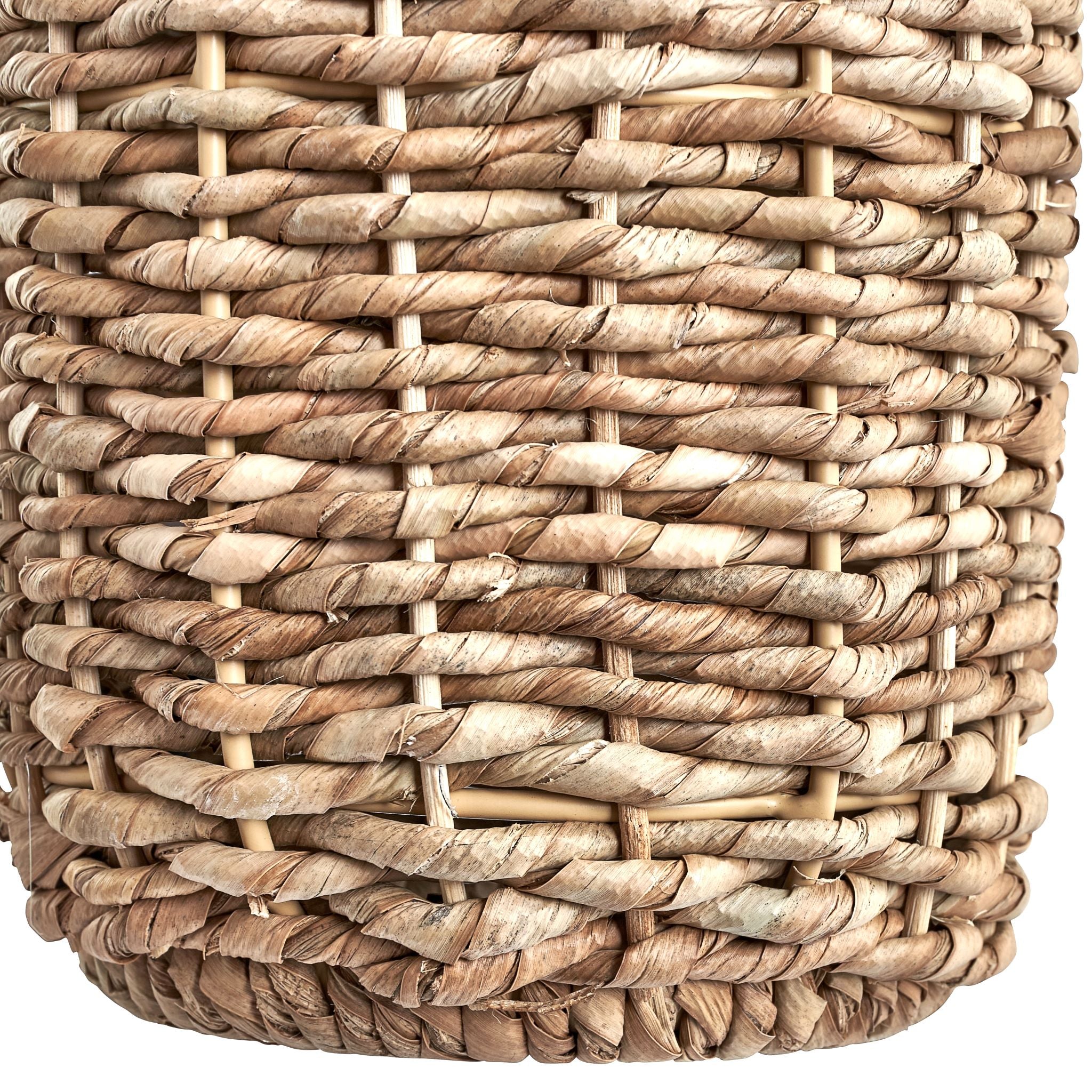 Close-up of a Pacific Lifestyle Acer Natural Woven Tall Table Lamp in ivory, showcasing its detailed woven pattern and natural fiber texture in neutral tones reminiscent of wicker.