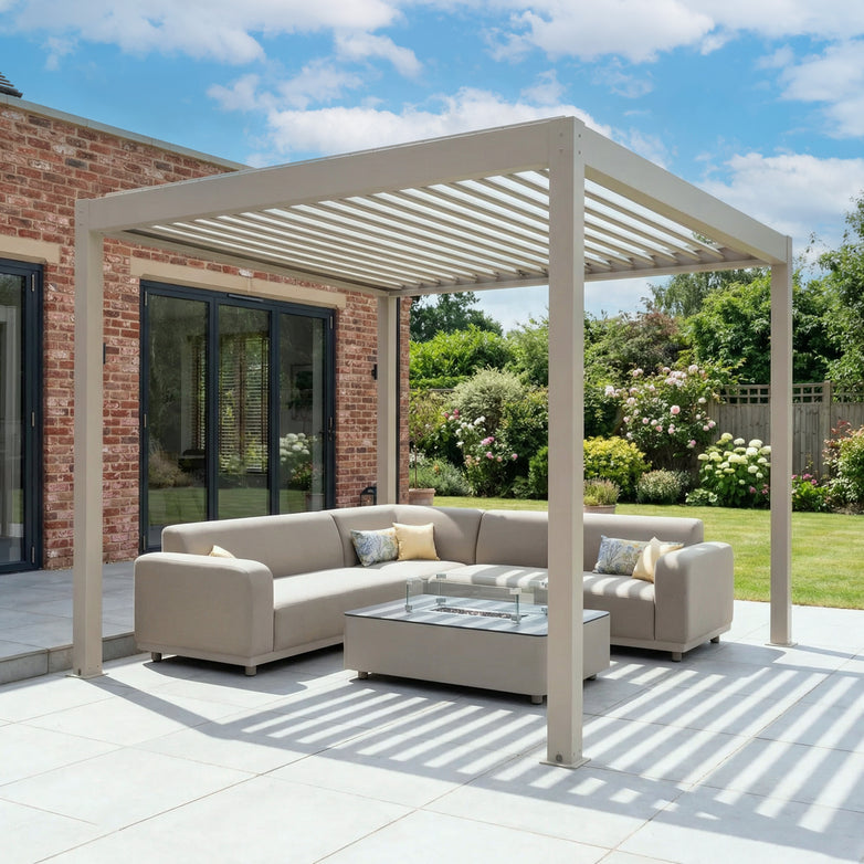Modern outdoor patio featuring the PergoSTET Plus Frame Only 3m x 3m Square Pergola with LED Lighting in Latte, beige sectional sofas, and a glass coffee table on a sunny day.