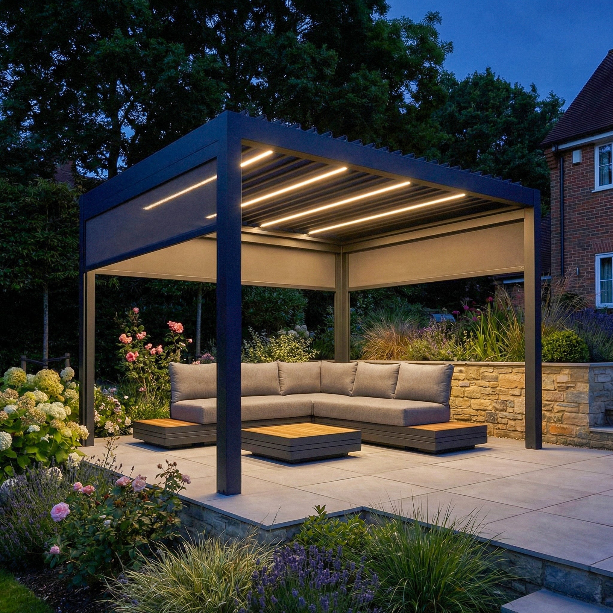 The PergoSTET Deluxe 3m x 3m Square Pergola features motorised LED louvres, three manual side blinds in grey, and is ideal for stylish outdoor spaces with modern comfort.