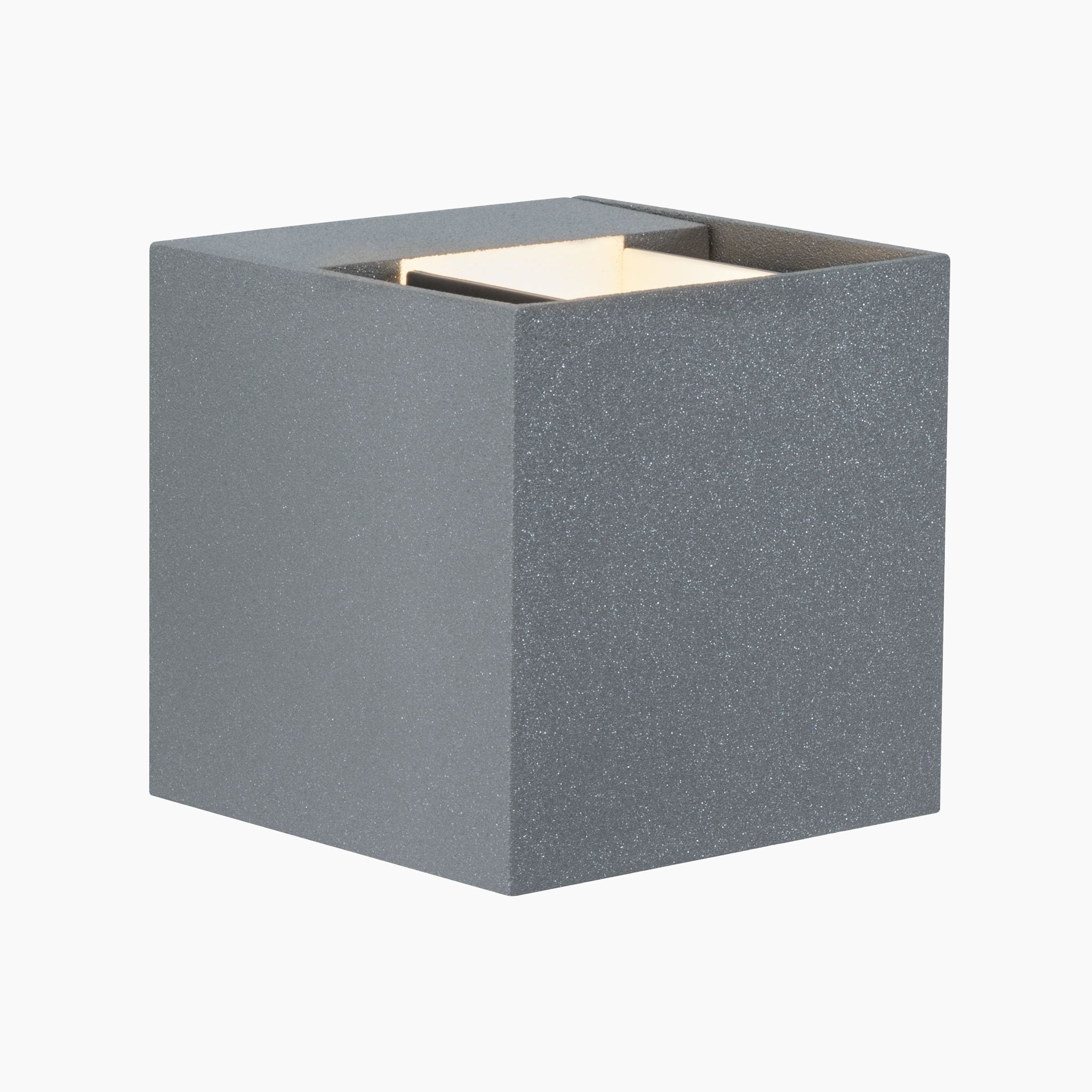 An outdoor wall luminaire by Paulmann, the Cybo 7.7W LED in Grey, boasts a cube shape with a textured surface, offering an adjustable beam angle and captivating light effects from within its 8x8cm frame.