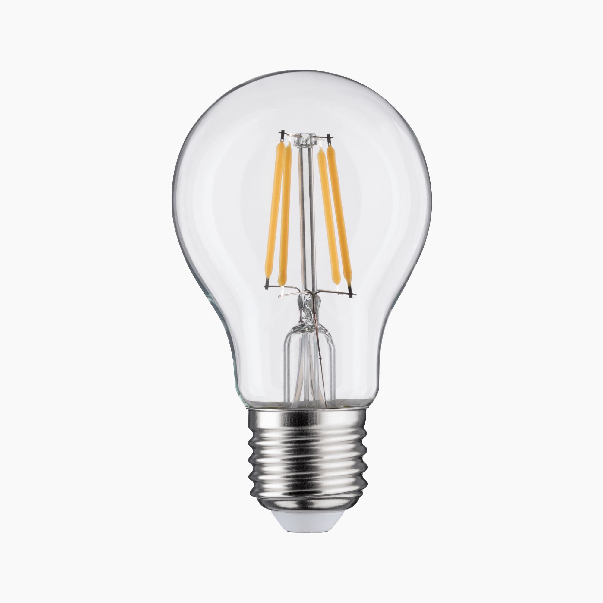 The Paulmann Filament LED Pear Bulb 5W E27 features a clear design with visible filaments, a silver screw base compatible with E27 sockets, and transparent glass set against a plain background, emitting a cozy warm white light.