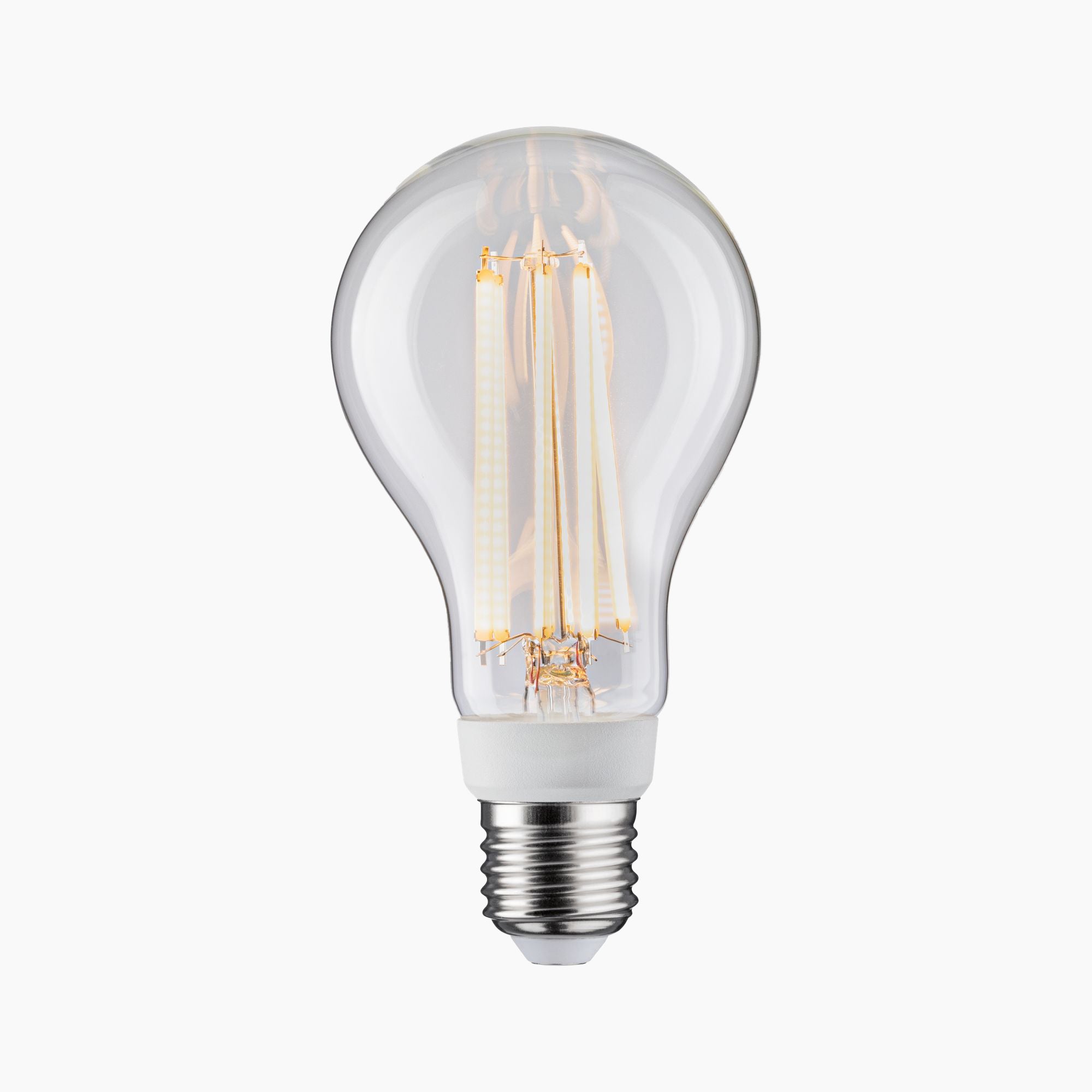 The Paulmann Filament LED Pear Bulb 15W E27 Warm White brilliantly shines against a white background, showcasing its visible filaments.