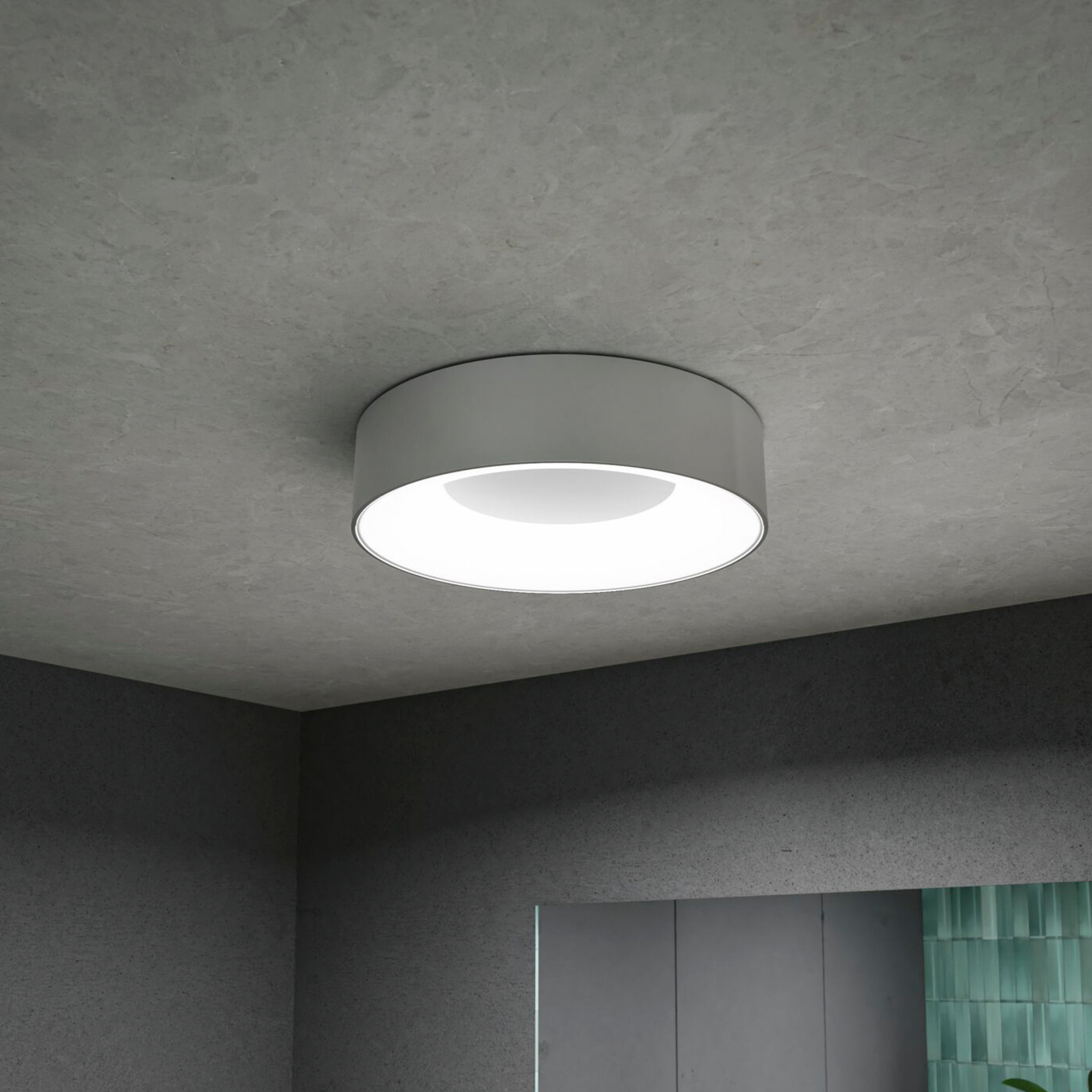 The gray-toned room is elegantly illuminated by the Paulmann - Casca 18W LED Switch 1500lm Ceiling Light in Matt Aluminium, featuring a sleek, modern design.