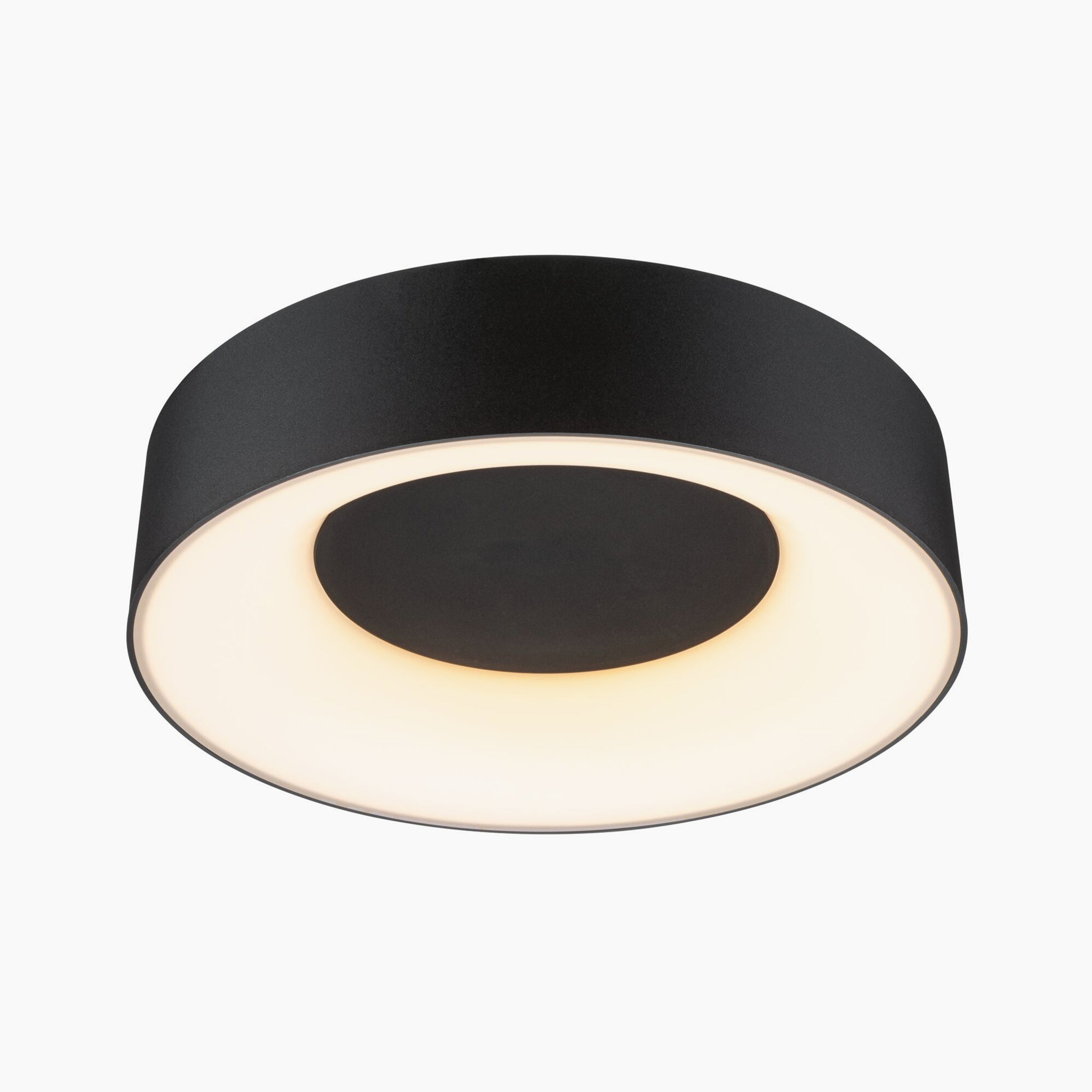 The Paulmann Casca 18W LED Switch 1500lm Ceiling Light in Black Matt offers a contemporary circular design and emits a soft white glow that enhances the overall light color, providing a gentle lighting effect.