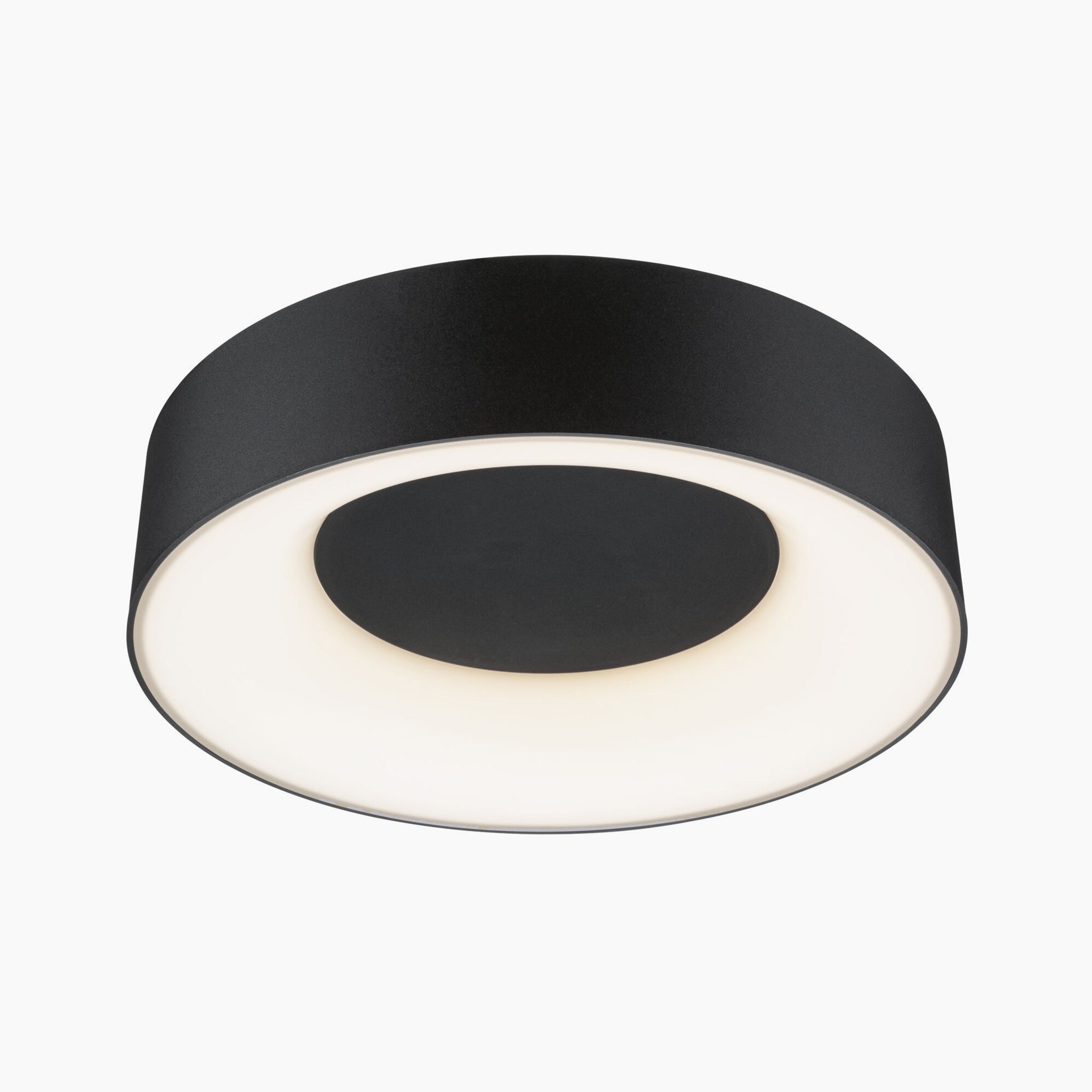 The Paulmann Casca 18W LED Switch Ceiling Light in Black Matt is a circular fixture with a white diffuser, providing a gentle glow and creating a soothing lighting atmosphere.