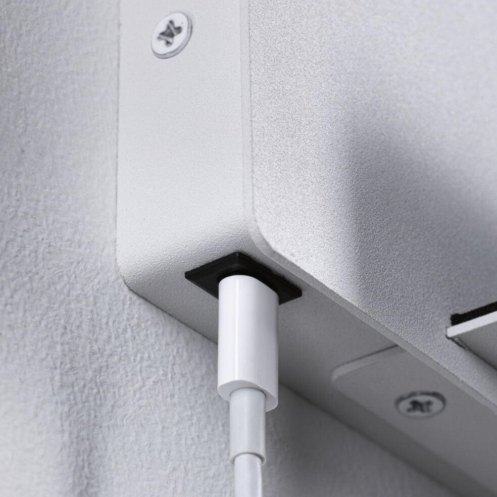 Close-up of the Paulmann - Halina 3.5W LED Wall Light with USB Charging Port in White Matt, featuring a white cable plugged into its wall-mounted metal design, with visible screws and seamlessly integrated LED lighting for enhanced visibility.