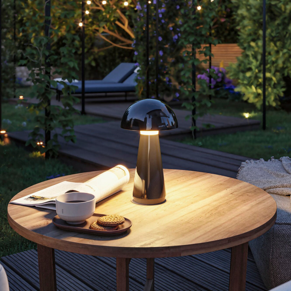 Outdoor table lamp on a garden dining table