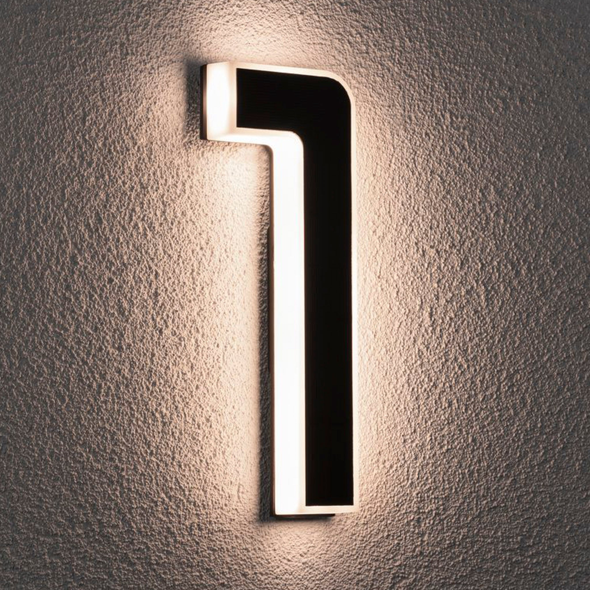 A numeral one from the Paulmann Outdoor Solar House Number, featuring a 0.2W LED with a replaceable battery in black, emits a subtle glow against the textured wall, much like an elegant house number luminaire.