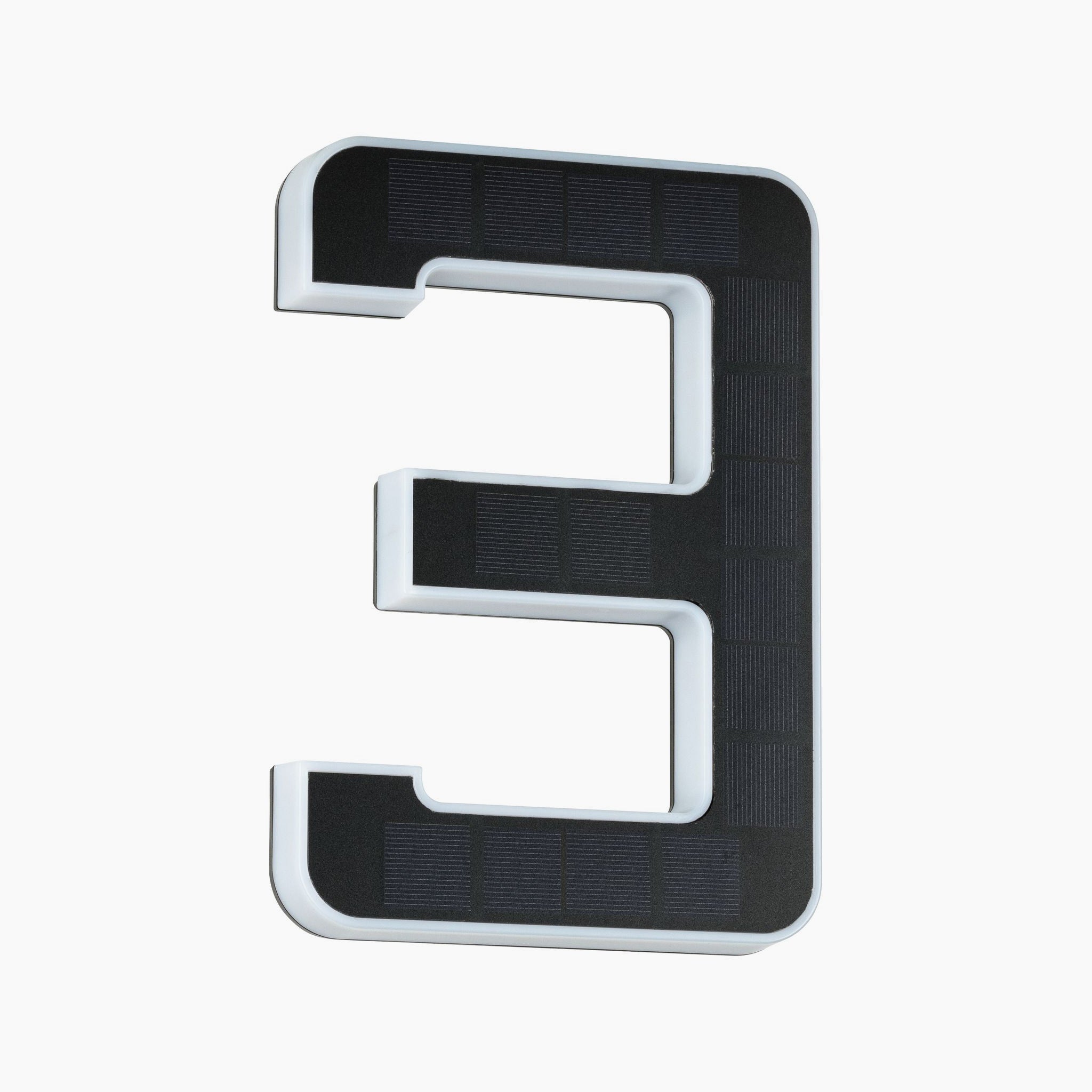 The Paulmann Outdoor Solar House Number 3 LED, featuring a 0.2W light with a replaceable battery, showcases a sleek black number against a clean backdrop for a contemporary aesthetic.