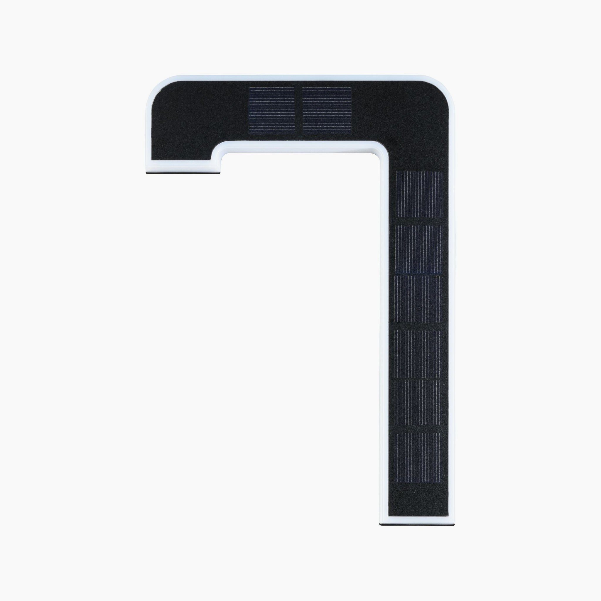 A black and white elbow-shaped object with rectangular patterns on a white background resembles the Paulmann Outdoor Solar House Number 7 LED 0.2W with Replaceable Battery in Black, seamlessly blending functionality and design.