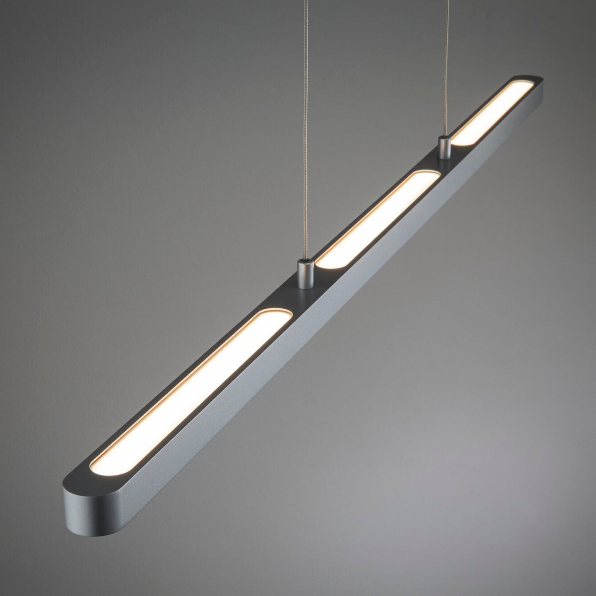 The Paulmann - Lento 37W LED Dimmable Pendant Light in Chrome Matt boasts a sleek and modern minimalist design, with evenly spaced LED panels providing high lumen output. This height-adjustable fixture is ideal for any environment and offers full dimmability to match your mood.