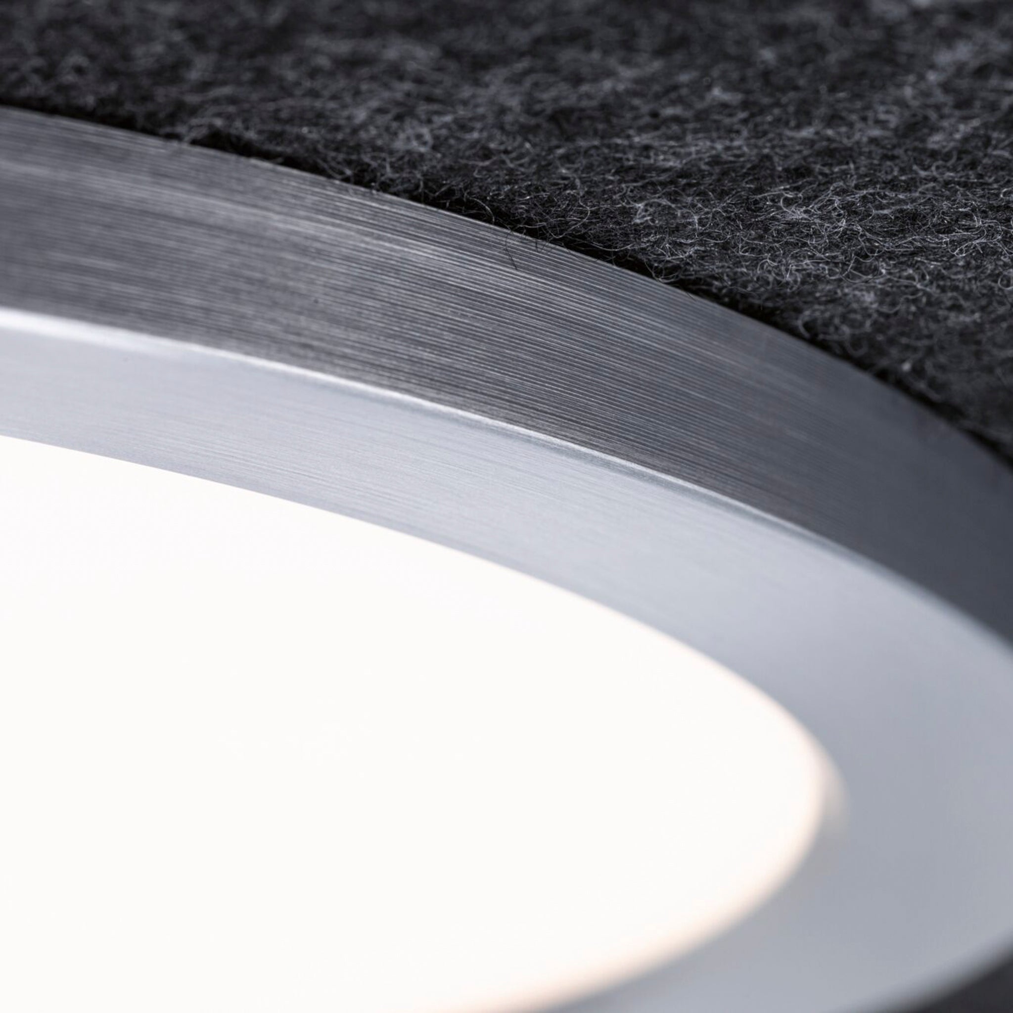 Close-up of the Paulmann Tulga 32.5W LED Ceiling Light, featuring a round, modern design with a textured surface in anthracite, crafted from recycled materials and offering 3-step dimming functionality.