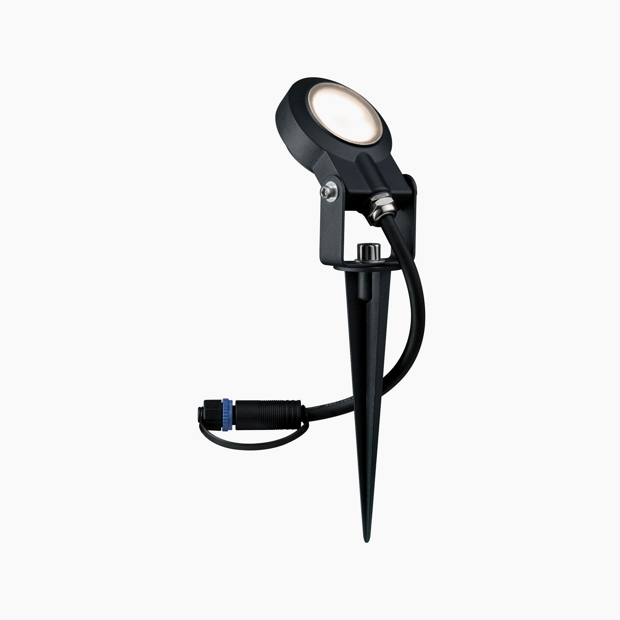 The Paulmann Plug & Shine Outdoor Sting 6.3W LED spotlight in anthracite is equipped with a stake and attached cable, offering warm white light and weatherproof illumination for any landscape.