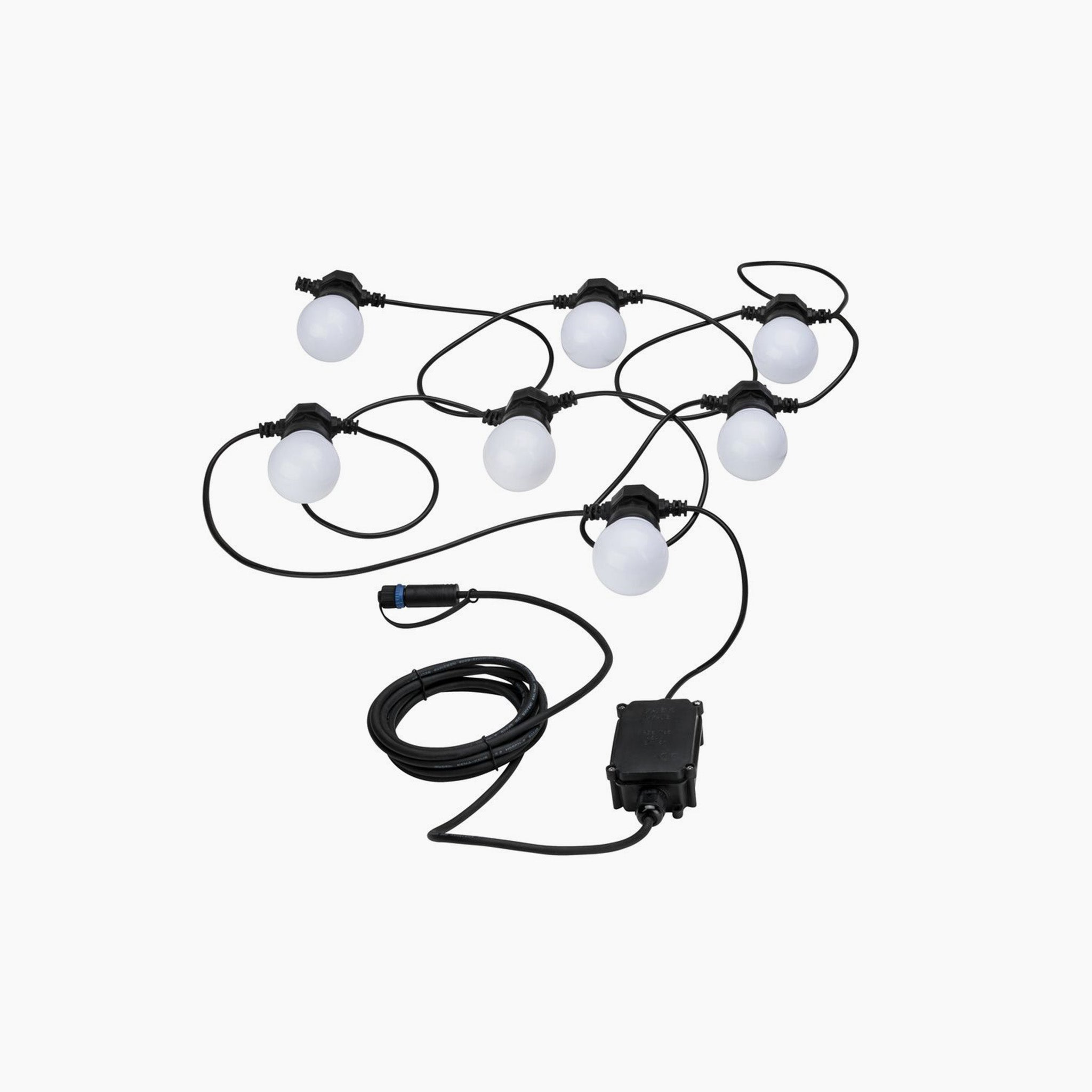 Paulmann's Plug & Shine Outdoor 1.5W LED Fairy Lights in Anthracite feature a string of round lights with a black cord and connector, arranged in a loose pattern on a white background, ideal for outdoor illumination. The system emits a cozy warm white light that enhances any environment.
