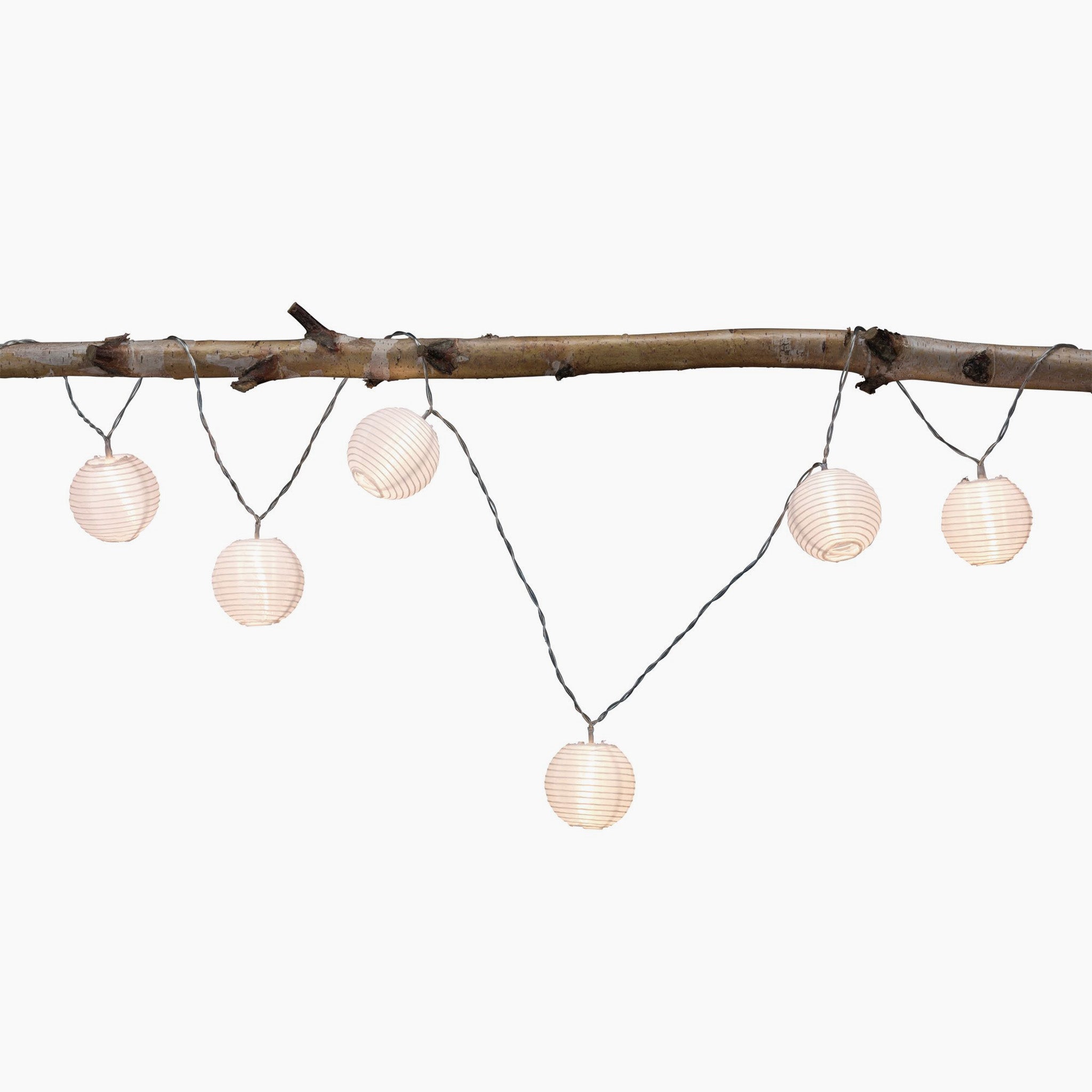 The Paulmann Outdoor Lampion LED 3.6m Fairy Lights, with its string of round paper lanterns hanging on a branch, creates a charming outdoor atmosphere. Rechargeable via USB, this light chain adds both convenience and enchantment to your evenings with its warm white glow.