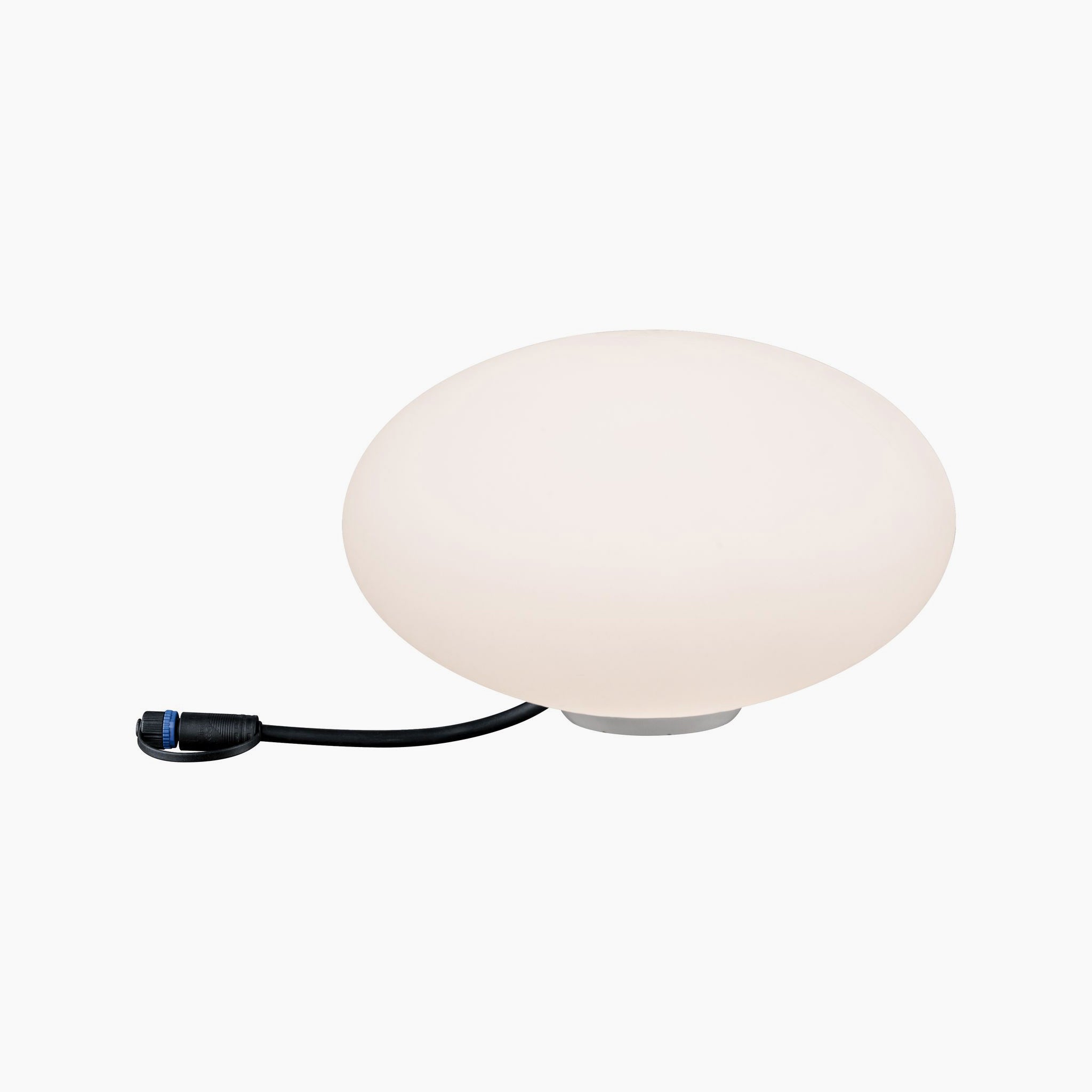 This floor lamp, named the Paulmann - Plug & Shine Outdoor Stone 2.8W LED 28cm, features a round white design that serves as a decorative eye-catcher. It comes with a sleek black cord and plug attached and includes a ground spike for easy outdoor installation.