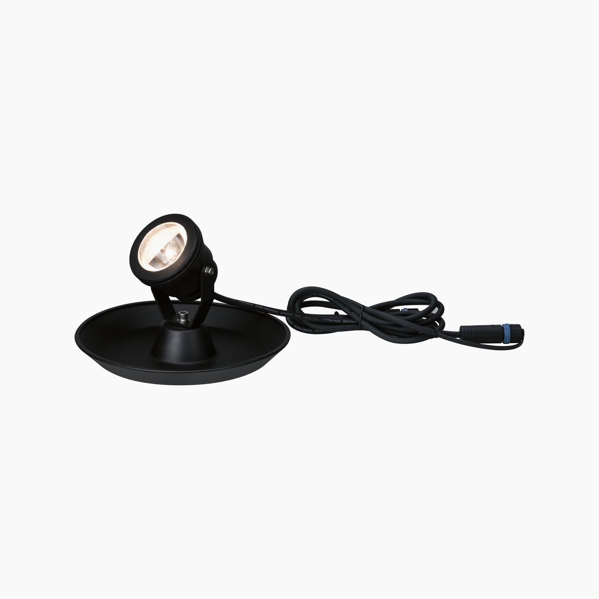 The Paulmann - Plug & Shine Outdoor 2.8W LED Pond Spotlight in Black is perfect for illuminating outdoor spaces, thanks to its round base and attached power cord. Its sleek design seamlessly blends with any setting, making it an ideal choice for the Plug & Shine system.