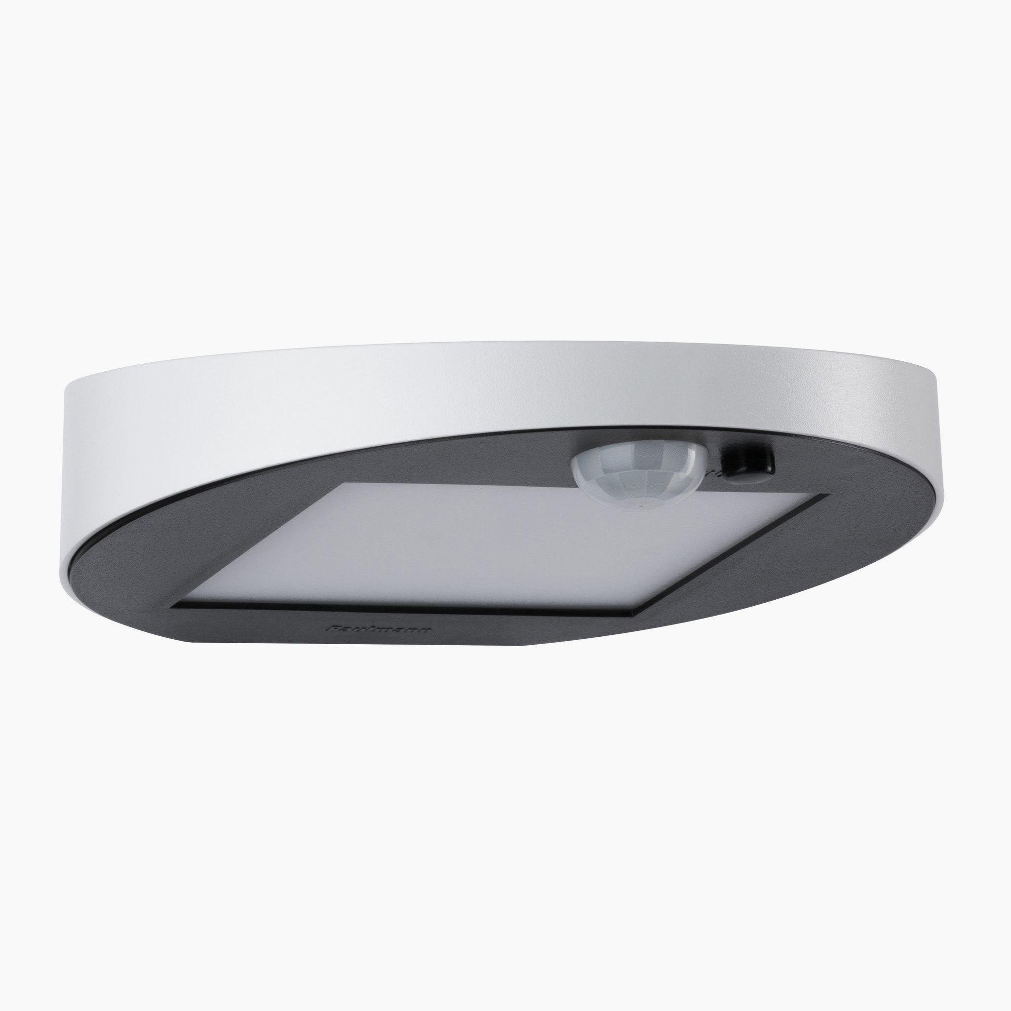 The Paulmann Outdoor Ryse 1.2W LED Solar Wall Light, featuring motion detection and a sleek oval design in white, is perfect for illuminating exterior walls.