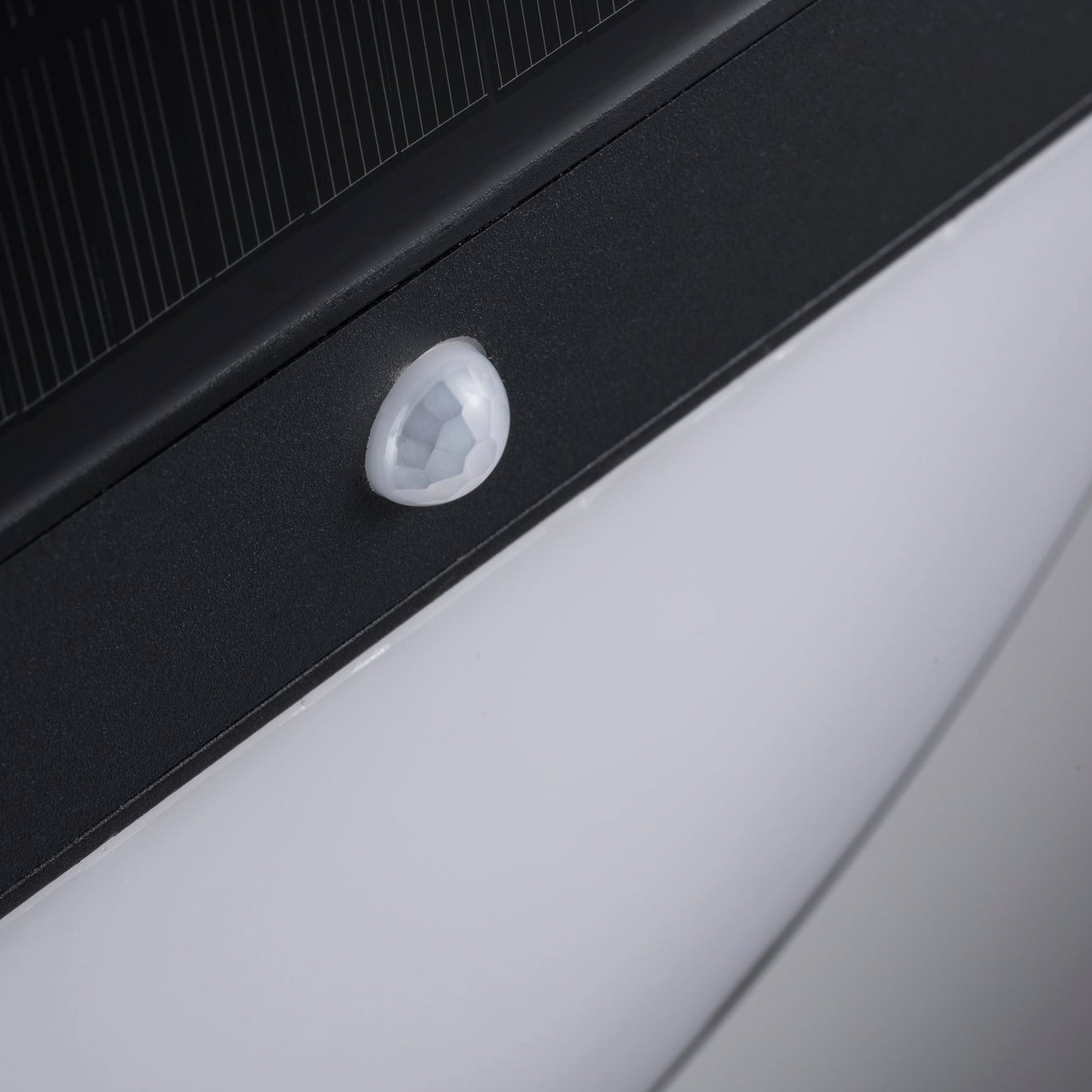 A close-up of the motion sensor on the sleek anthracite surface of the Paulmann Outdoor Elios 1W LED Solar Wall Light highlights its advanced solar technology, perfect for exterior walls.