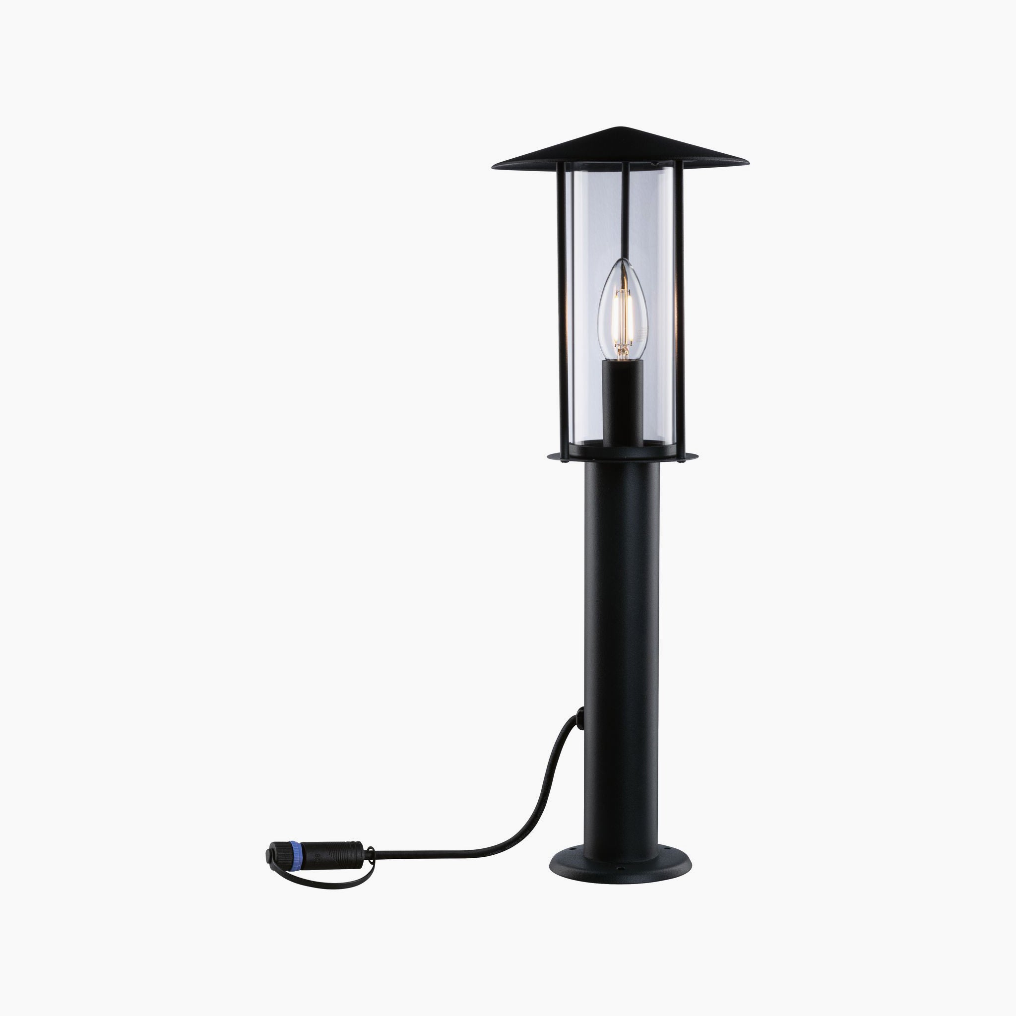 The Paulmann - Plug & Shine Outdoor Classic 2W LED Single 50cm Bollard Light in Anthracite is an elegant outdoor lantern with transparent panels and a visible bulb. Featuring a connected power cord, it is perfect for enhancing garden lighting with its sleek design that stands out against a white background, making it ideal for illuminating outdoor areas.