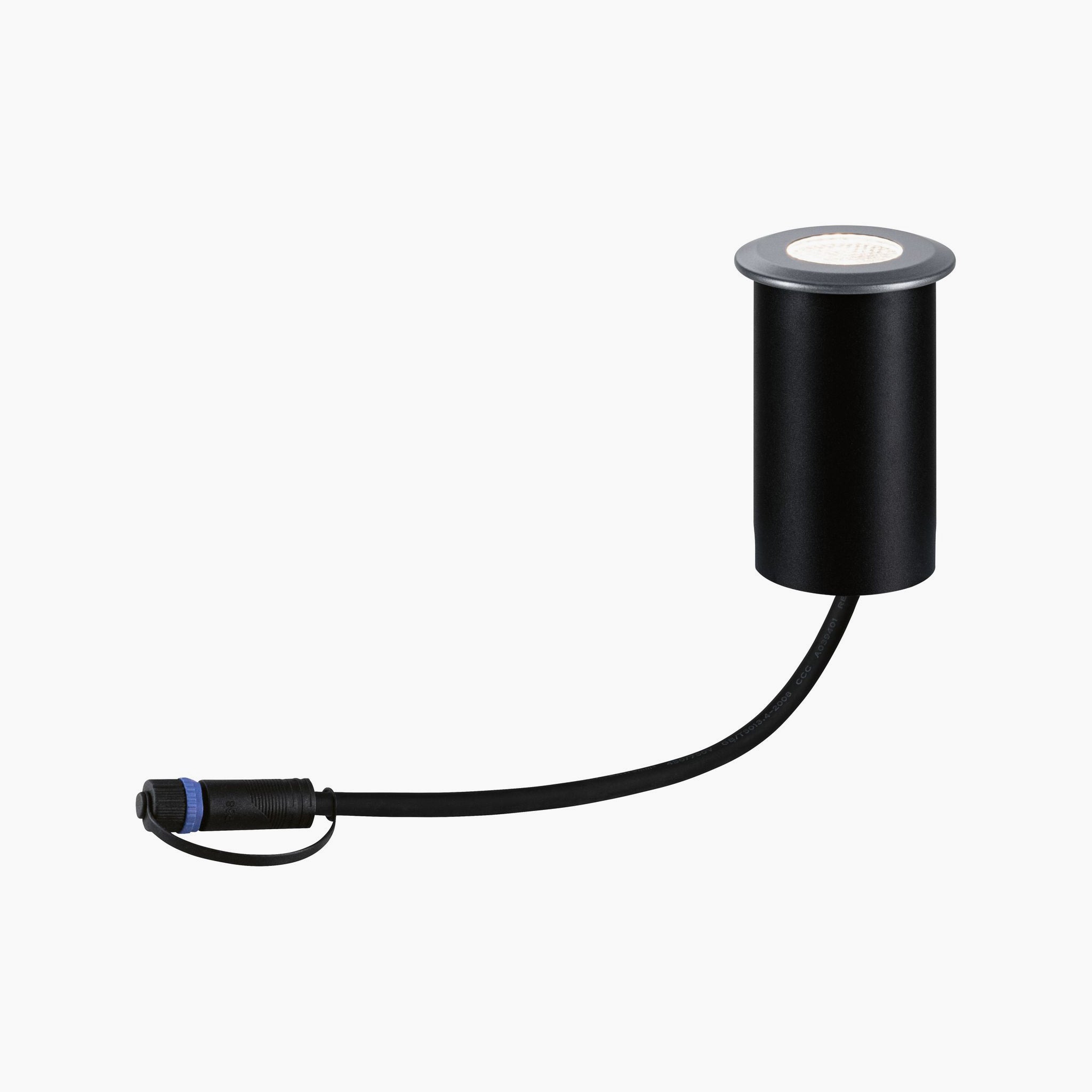 The Paulmann Plug & Shine Outdoor 7W LED Recessed Floor Spotlight, in a contemporary grey finish, showcases a sleek cylindrical design with an integrated cable and plug, ideal for enhancing your Plug & Shine system against a crisp white background.
