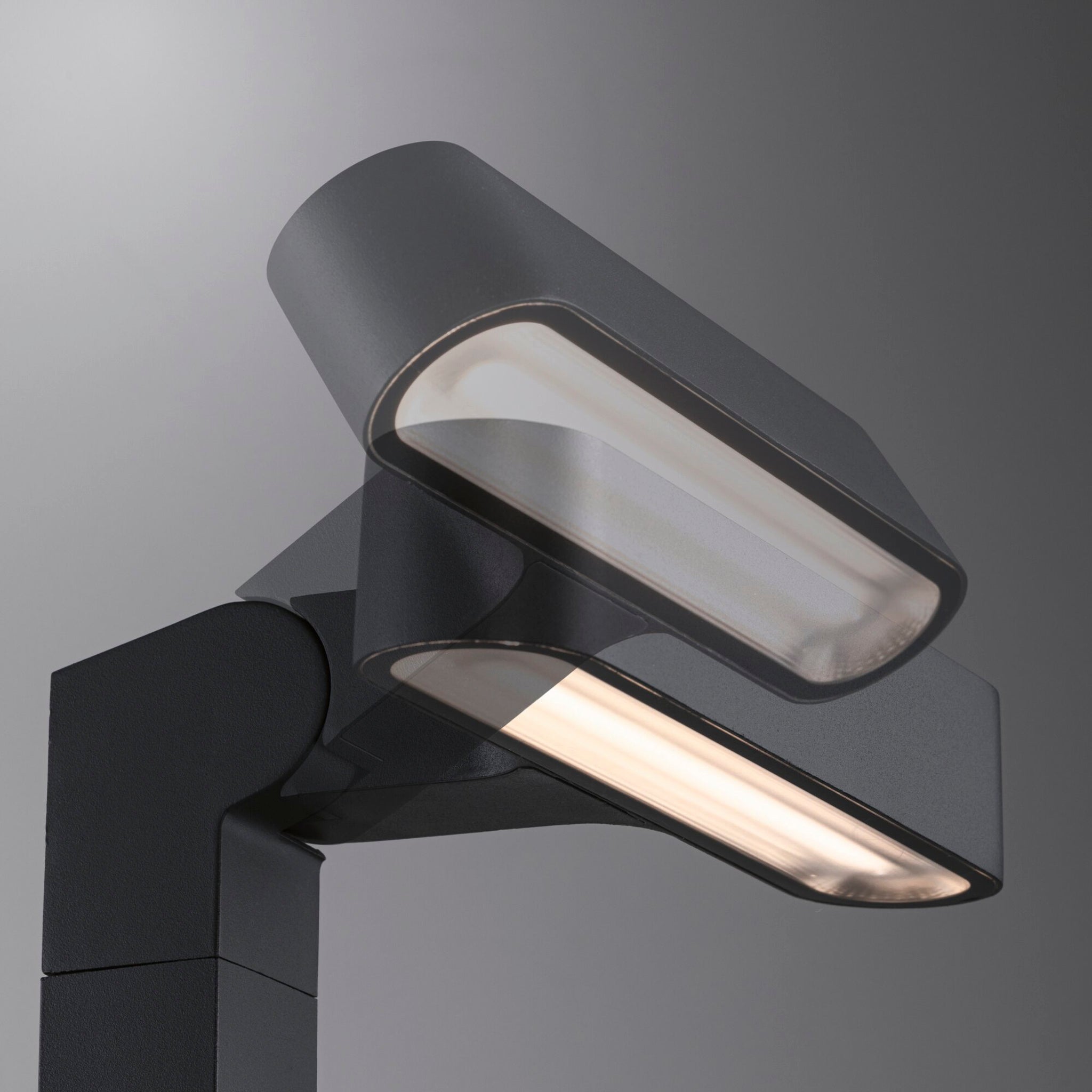 This modern streetlight features two rectangular LED panels against a gray background, ideal for innovative outdoor lighting solutions. Inspired by the sleek design of the Paulmann - Plug & Shine Outdoor Ito 6W LED Horizontal Bollard in Anthracite, it illuminates with style and efficiency.