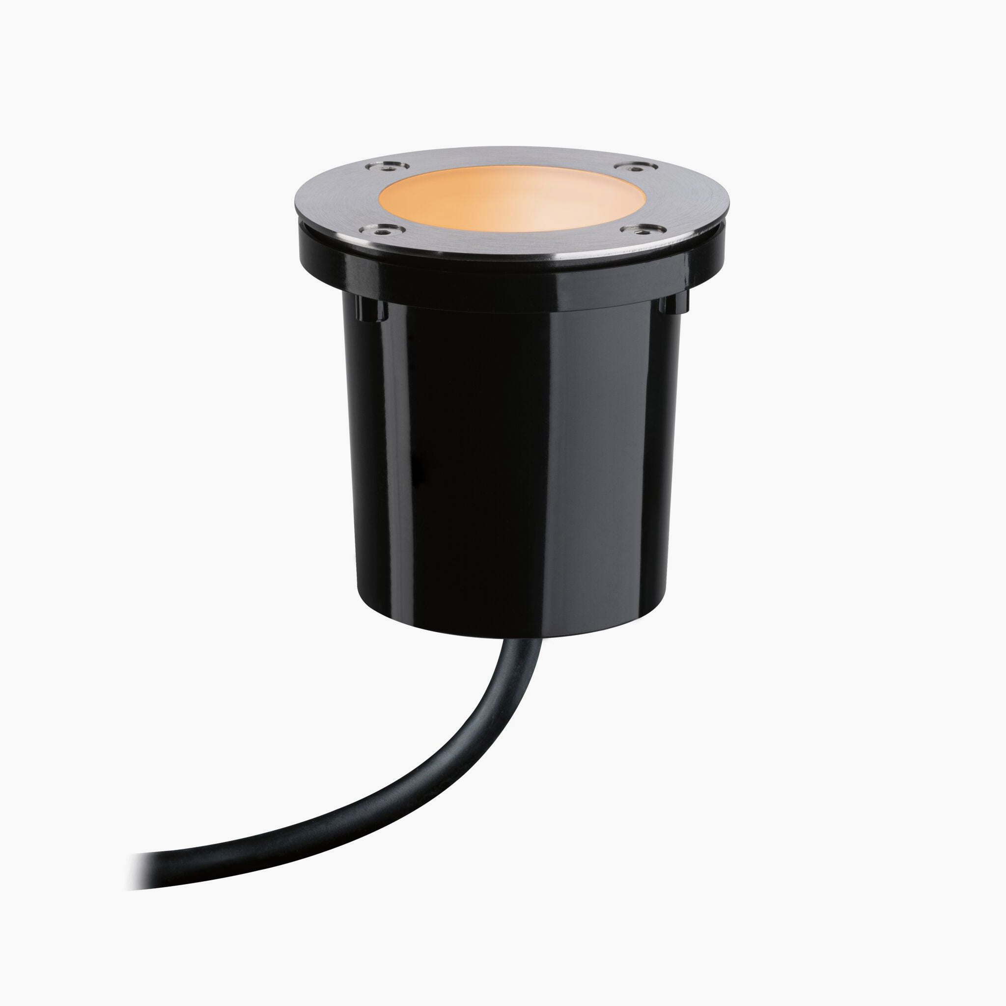 The Paulmann - Plug & Shine Outdoor 5.2W LED Recessed Spotlight in Black, featuring a round, amber-lit face and power cable, is seamlessly integrated with Zigbee 3.0 for smart control.