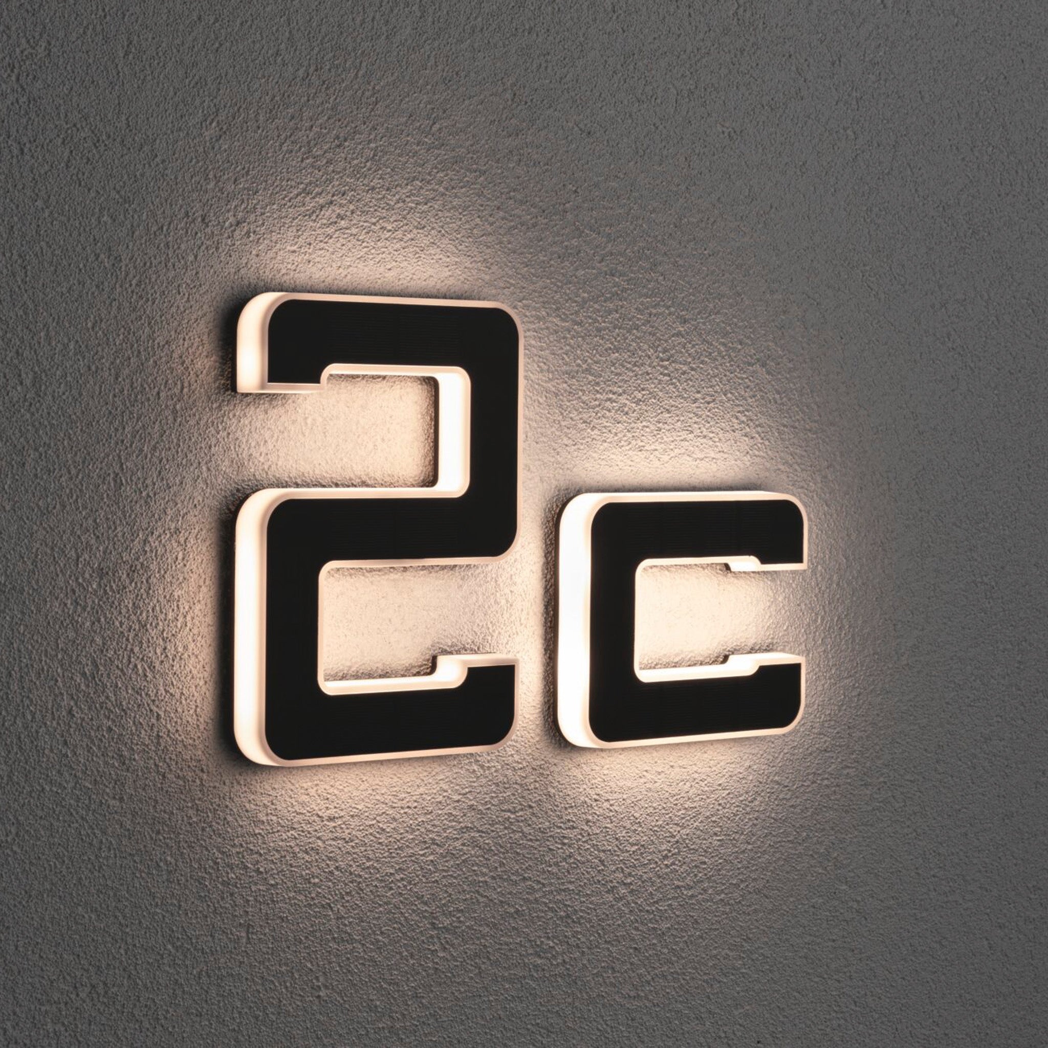 The Paulmann Outdoor Solar House Letter C features a modern, textured design and integrates an efficient LED 0.2W luminaire to display the number "2C" with enhanced visibility, complete with a replaceable battery in black for illuminated wall mounting.