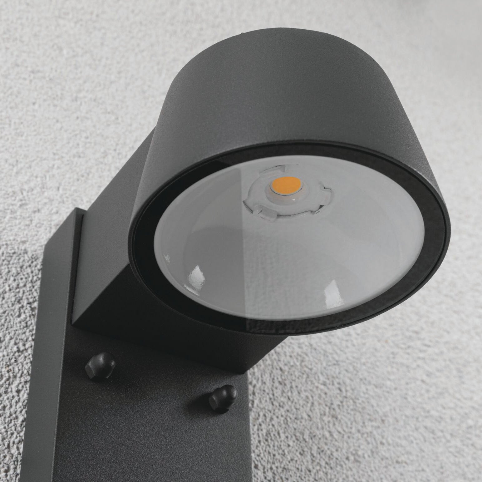 Close-up of the Paulmann Outdoor Capea 8W LED wall light in anthracite, featuring motion detection and insect-friendly illumination, elegantly mounted on a textured surface.